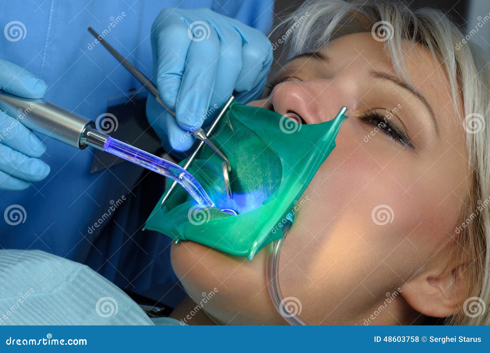 Dentist with Patient, Using Dental Curing Light Stock Photo Image of