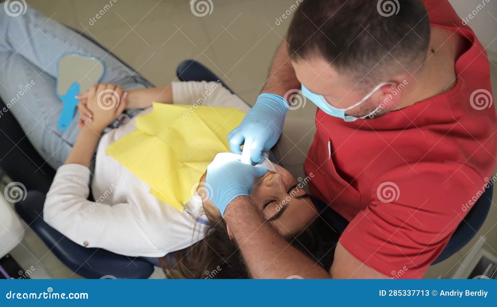 The Dentist Performs Teeth Whitening Using Modern Methods. Treatment and Whitening of Teeth