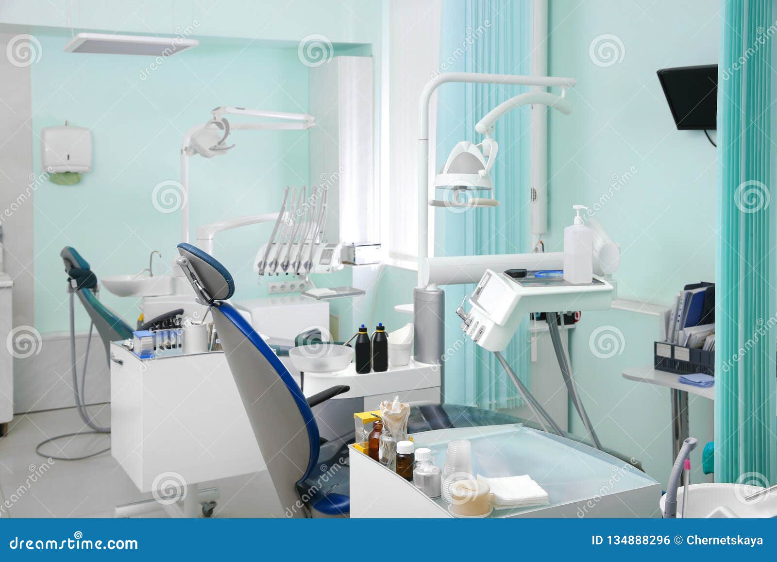 Dentist`s Office with Modern Chairs Stock Photo Image of drill