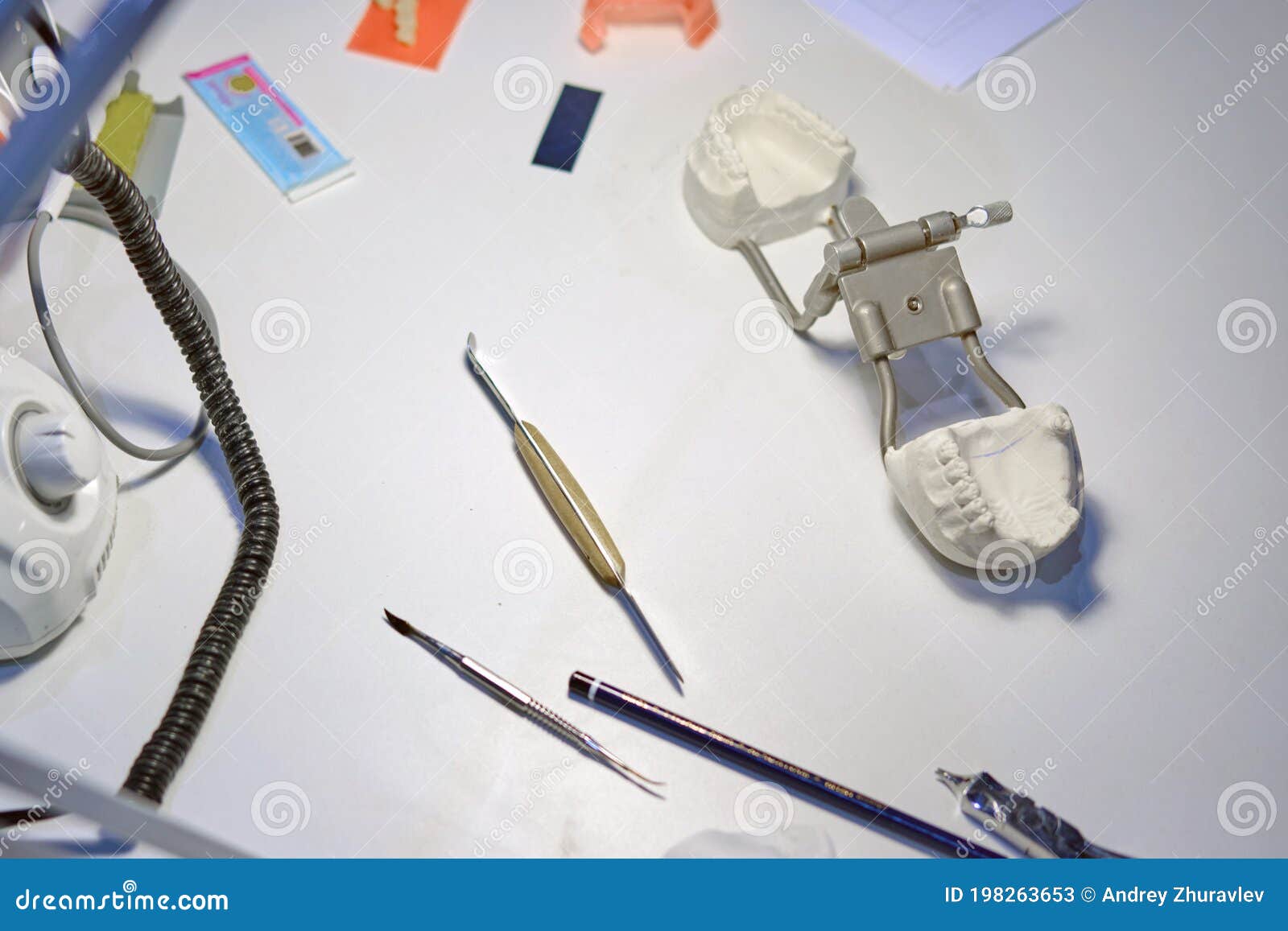 Dentist`s Tools and a Dental Impression on the Table of the Prosthetist