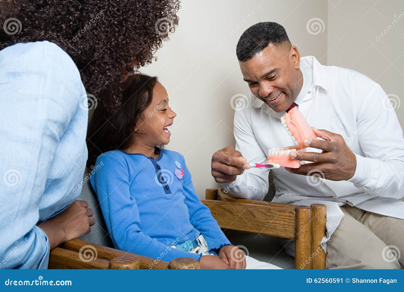 Dentist Showing Patient How To Clean Teeth Stock Image Image of