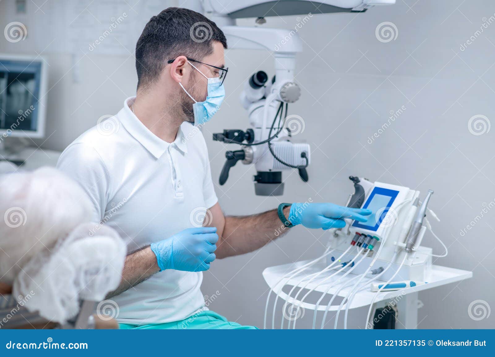 Dentist In Sterile Gloves Working With A Patient In His Office RoyaltyFree Stock Photography