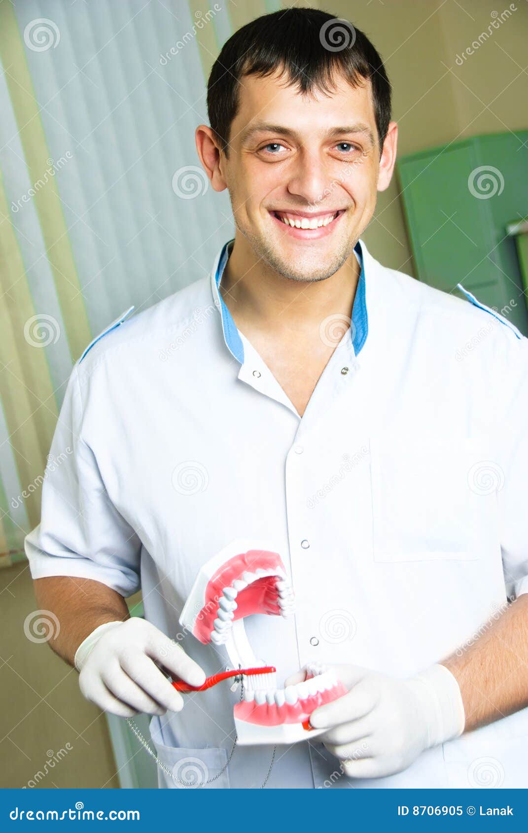 Dentist Teaching A Patient To Brush Teeth RoyaltyFree Stock