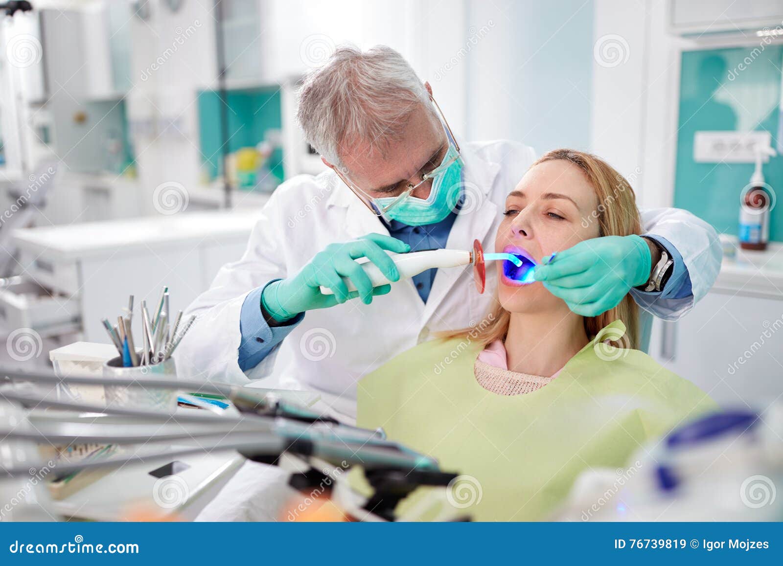 Dentist Use Dental Light Instrument for Working Stock Image Image of