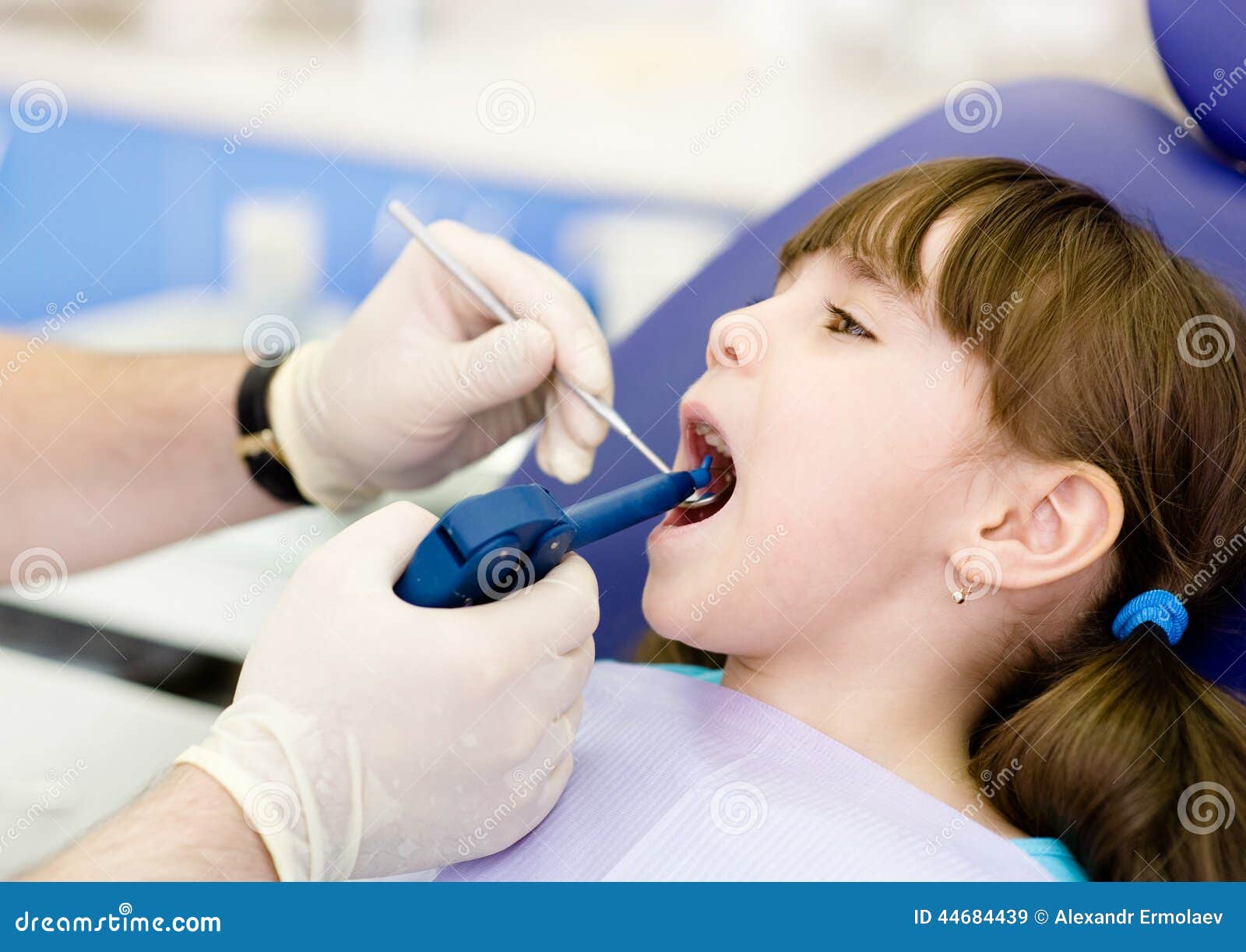 Dentist Using Dental Filling Gun on Kid Stock Image Image of little