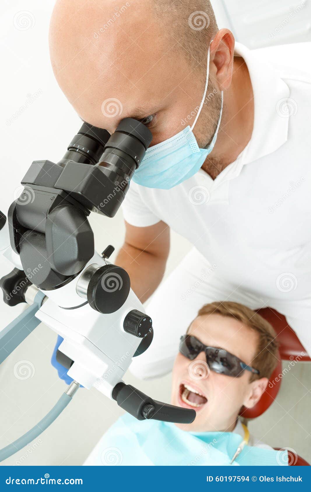 Dentist Using Dental Microscope during Inspection Stock Photo Image