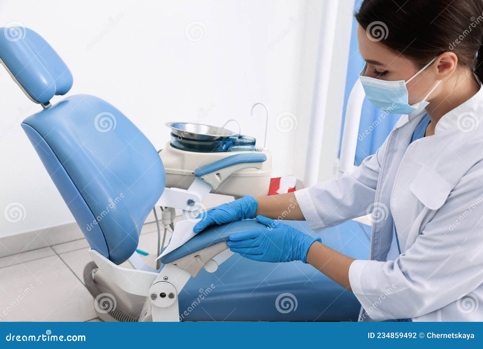 Professional Dentist in White Coat Cleaning Workplace Indoors Stock Photo Image of dentist