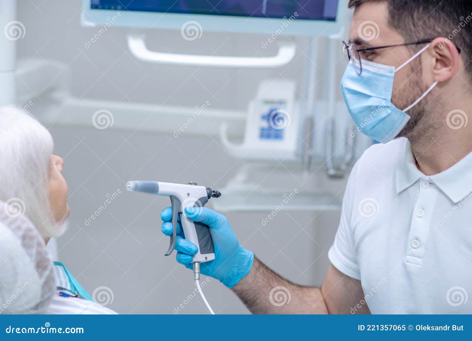 Dentist in Sterile Gloves Working with a Patient in His Office Stock Image Image of aged