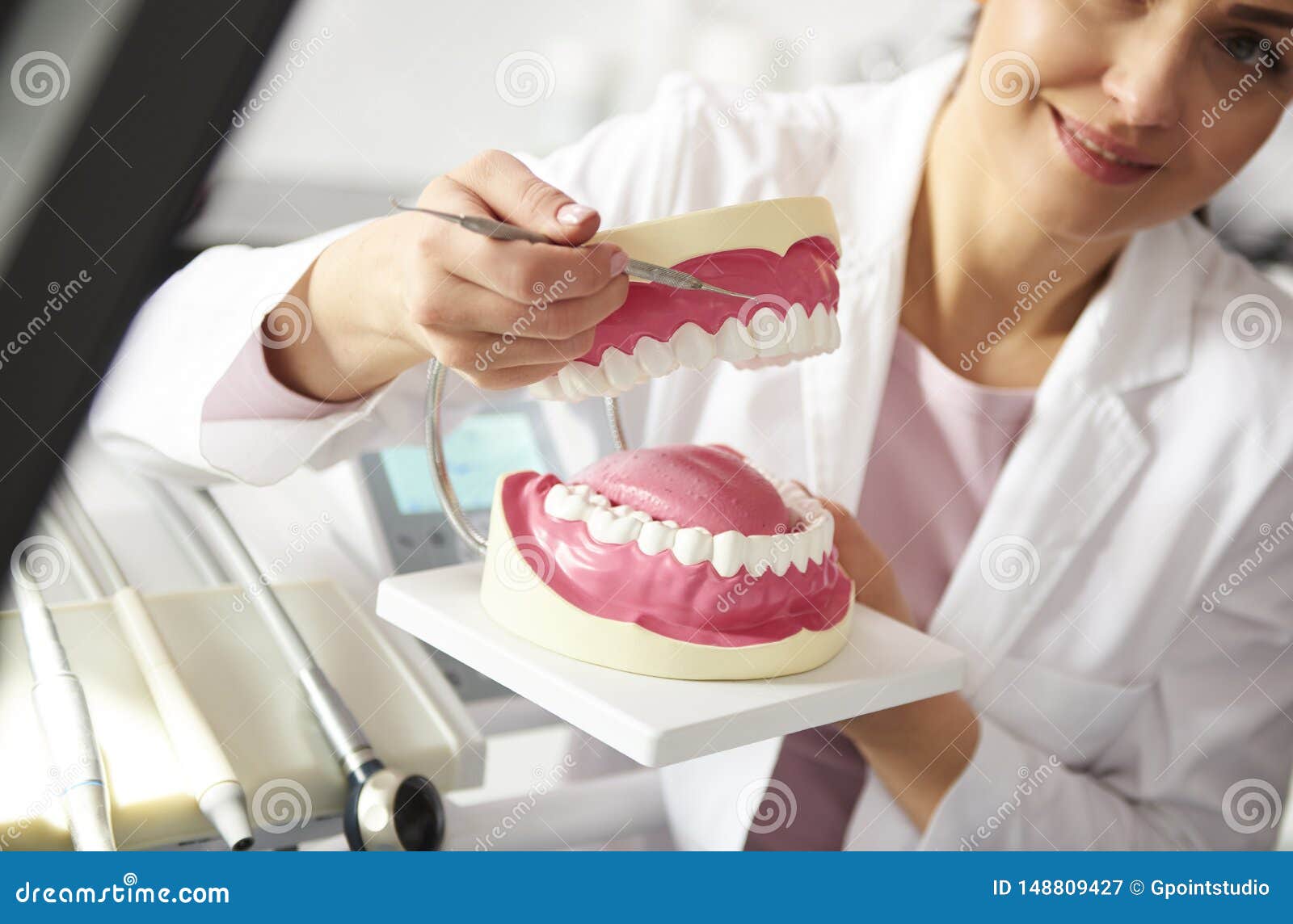 dentist working with artificial dentures