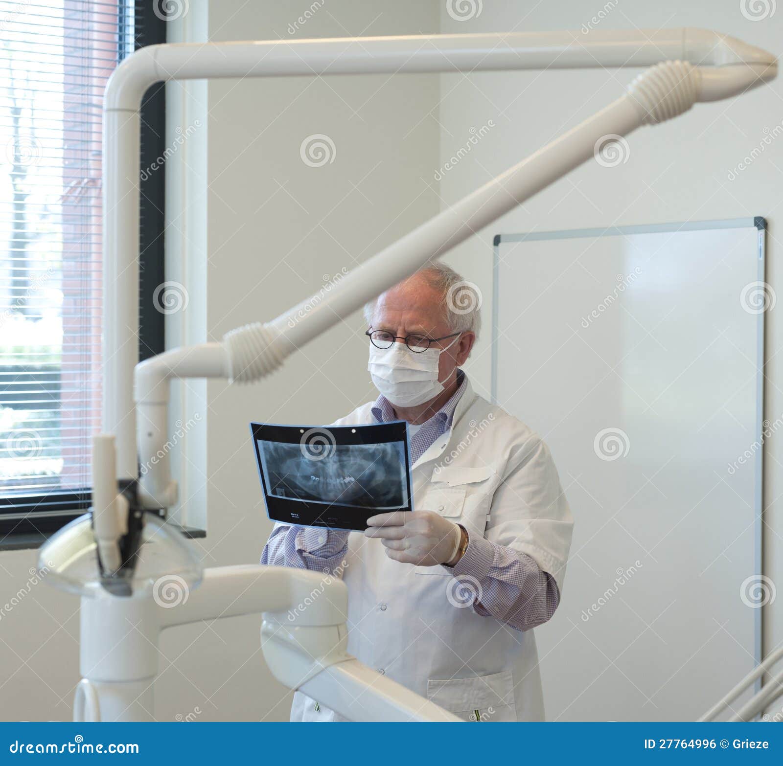 Dentist with xray in hand stock photo. Image of clinic 27764996