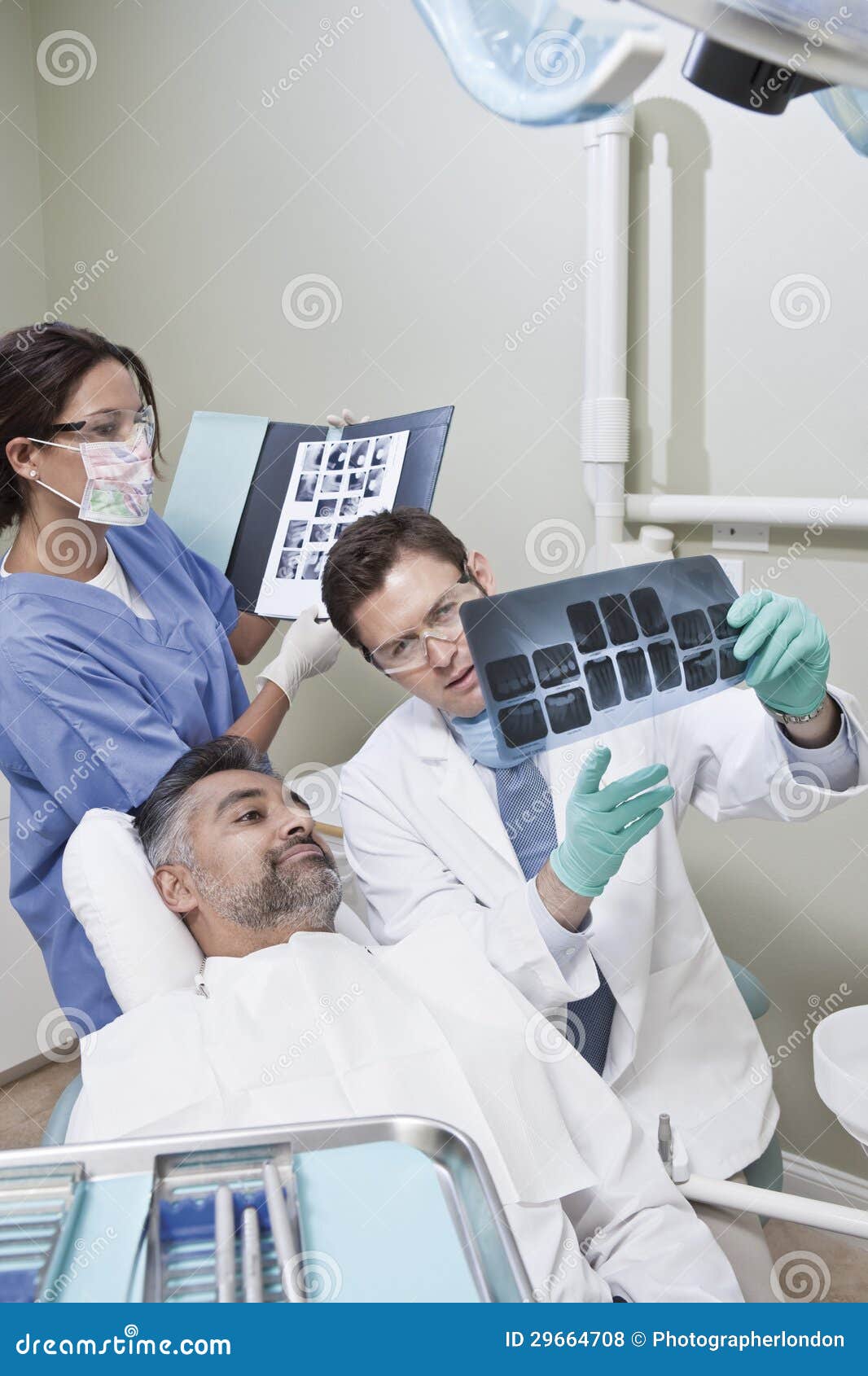 Dentists Explaining Xray Report To Patient Stock Photo Image of