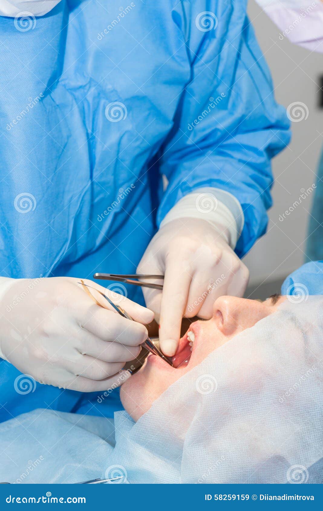 Dentists during surgery stock image. Image of health 58259159