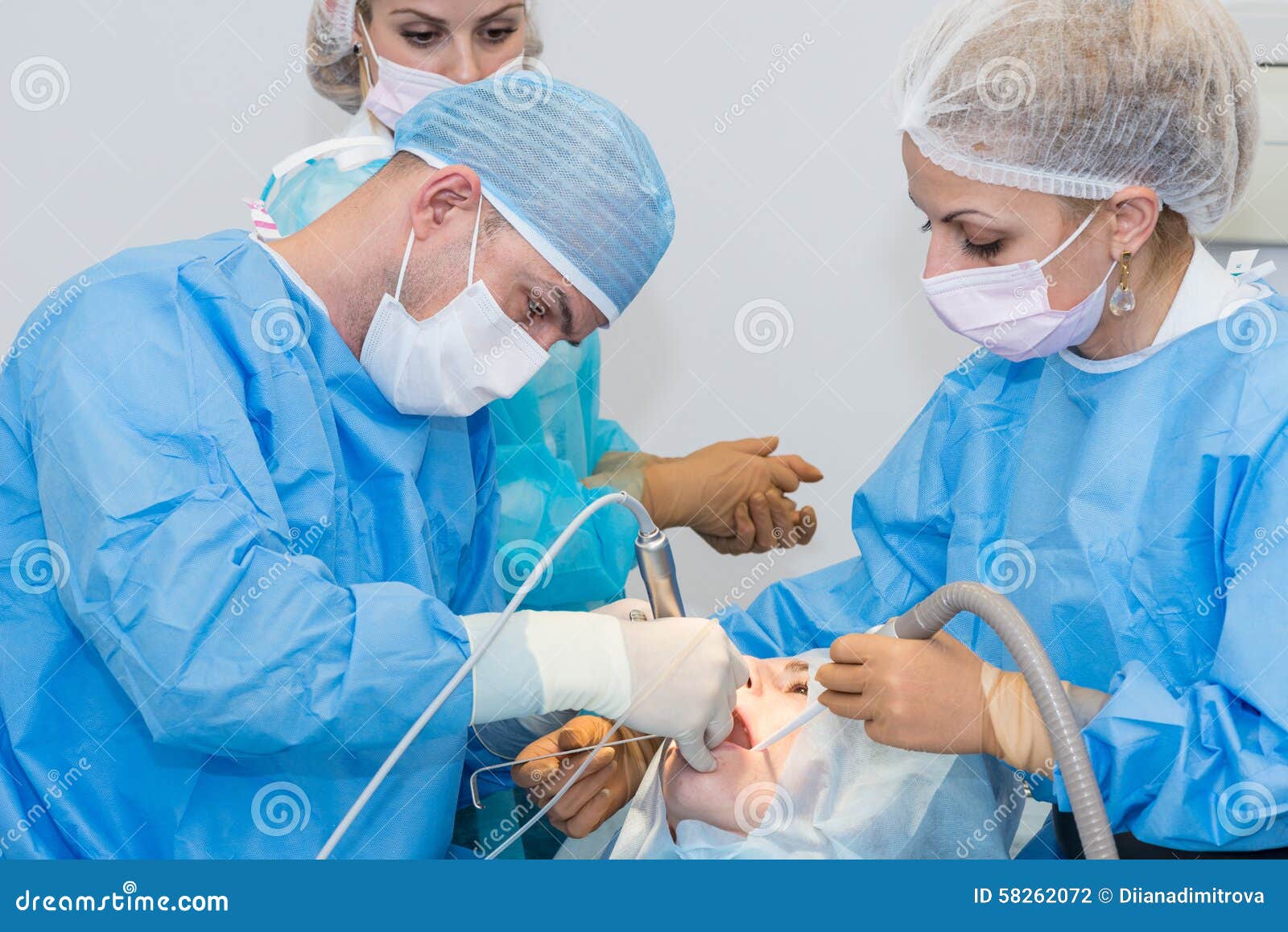 Dentists during surgery stock photo. Image of hygiene 58262072