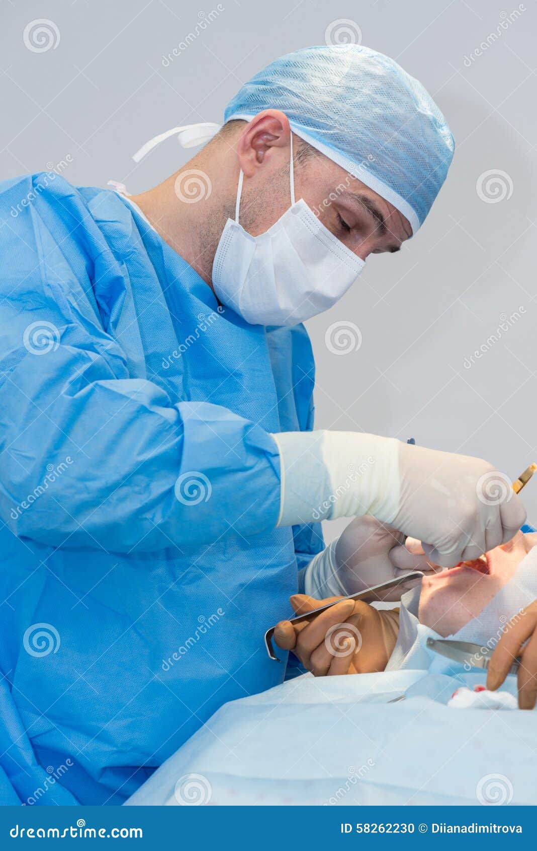 Dentists during surgery stock photo. Image of dentist 58262230