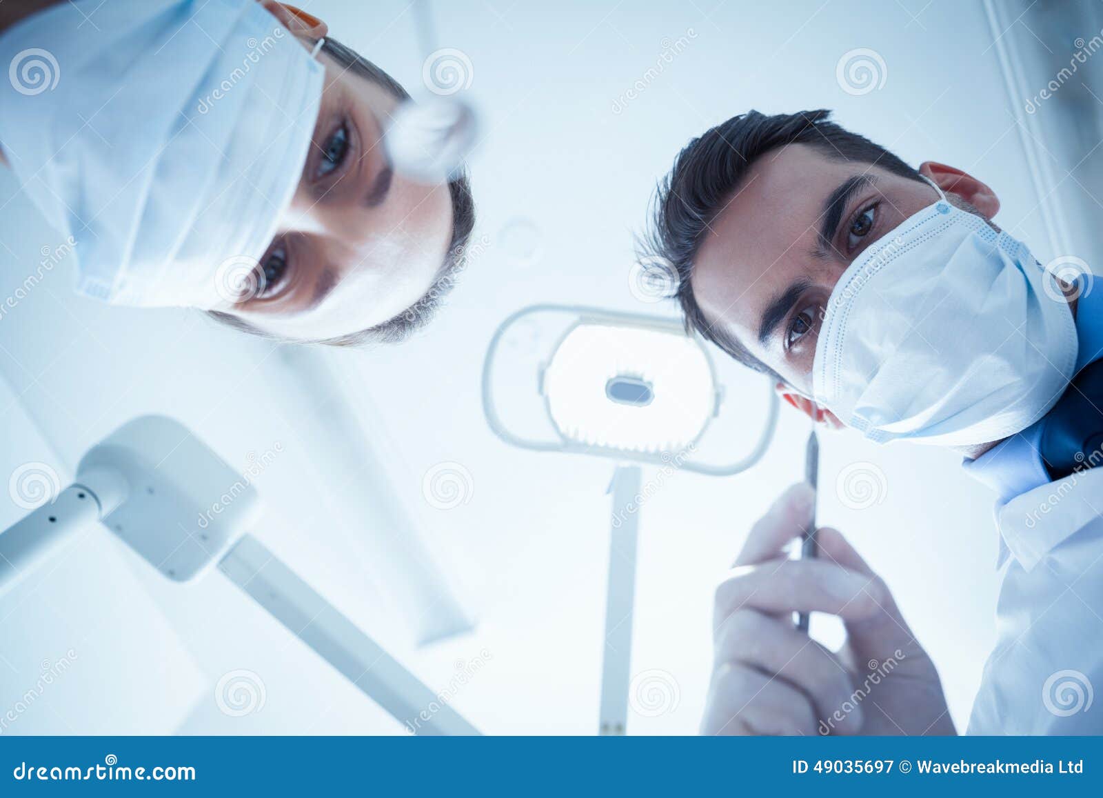 Dentists in Surgical Masks Holding Dental Tools Stock Image Image of