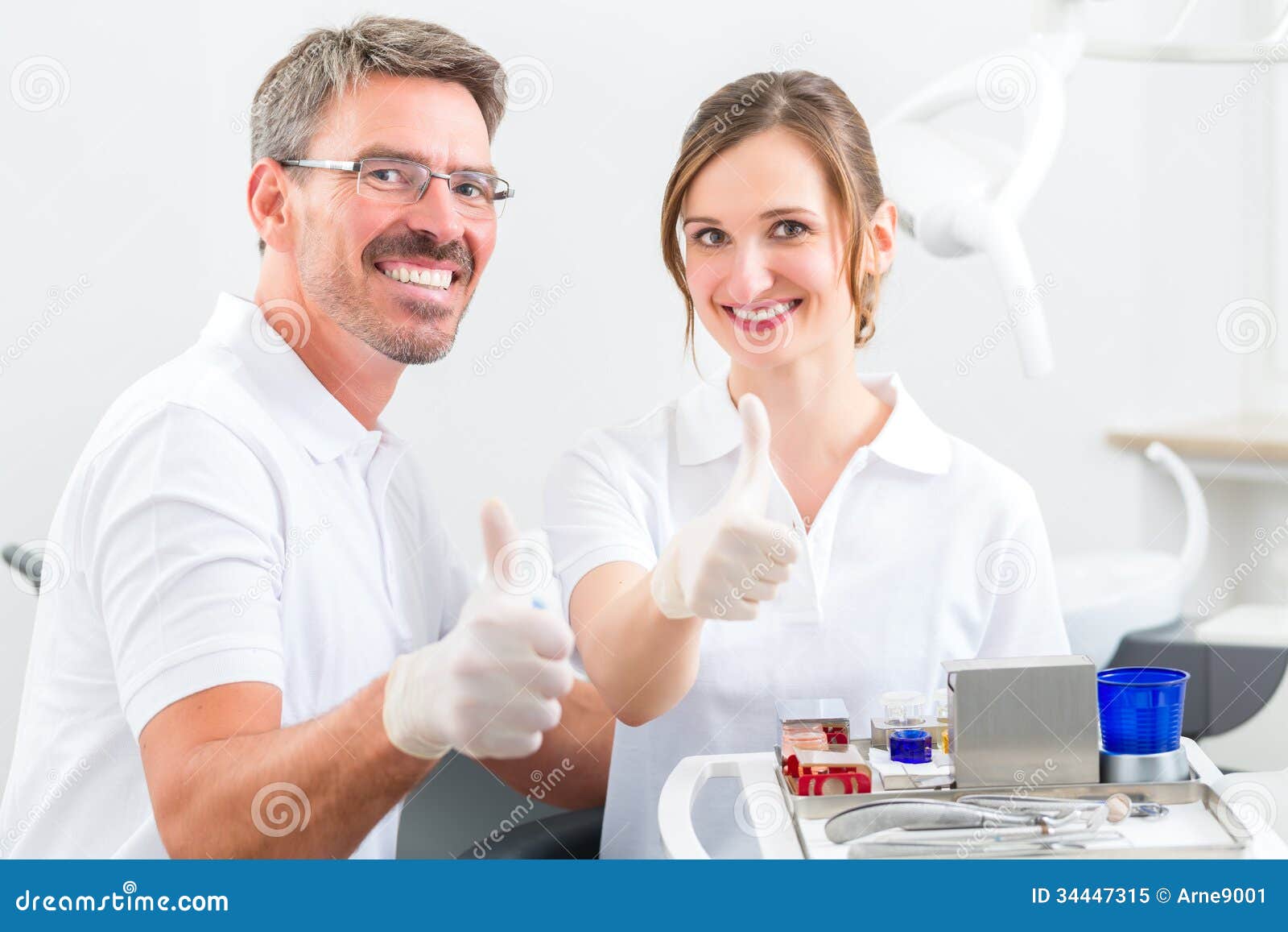 Dentists in Their Surgery or Office with Dental Tools Stock Image