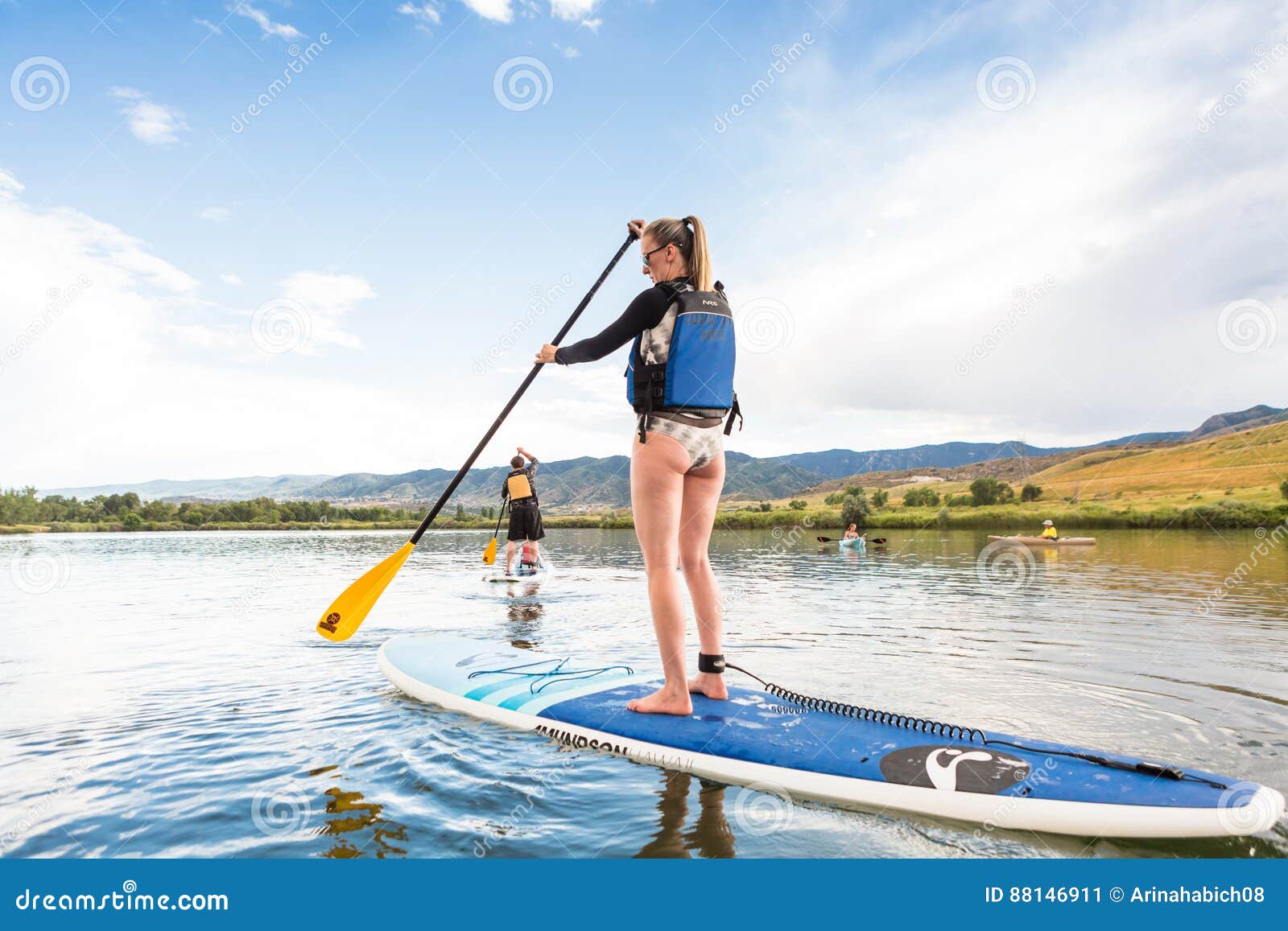 Paddleboarding editorial photo. Image of exercise, paddleboarding