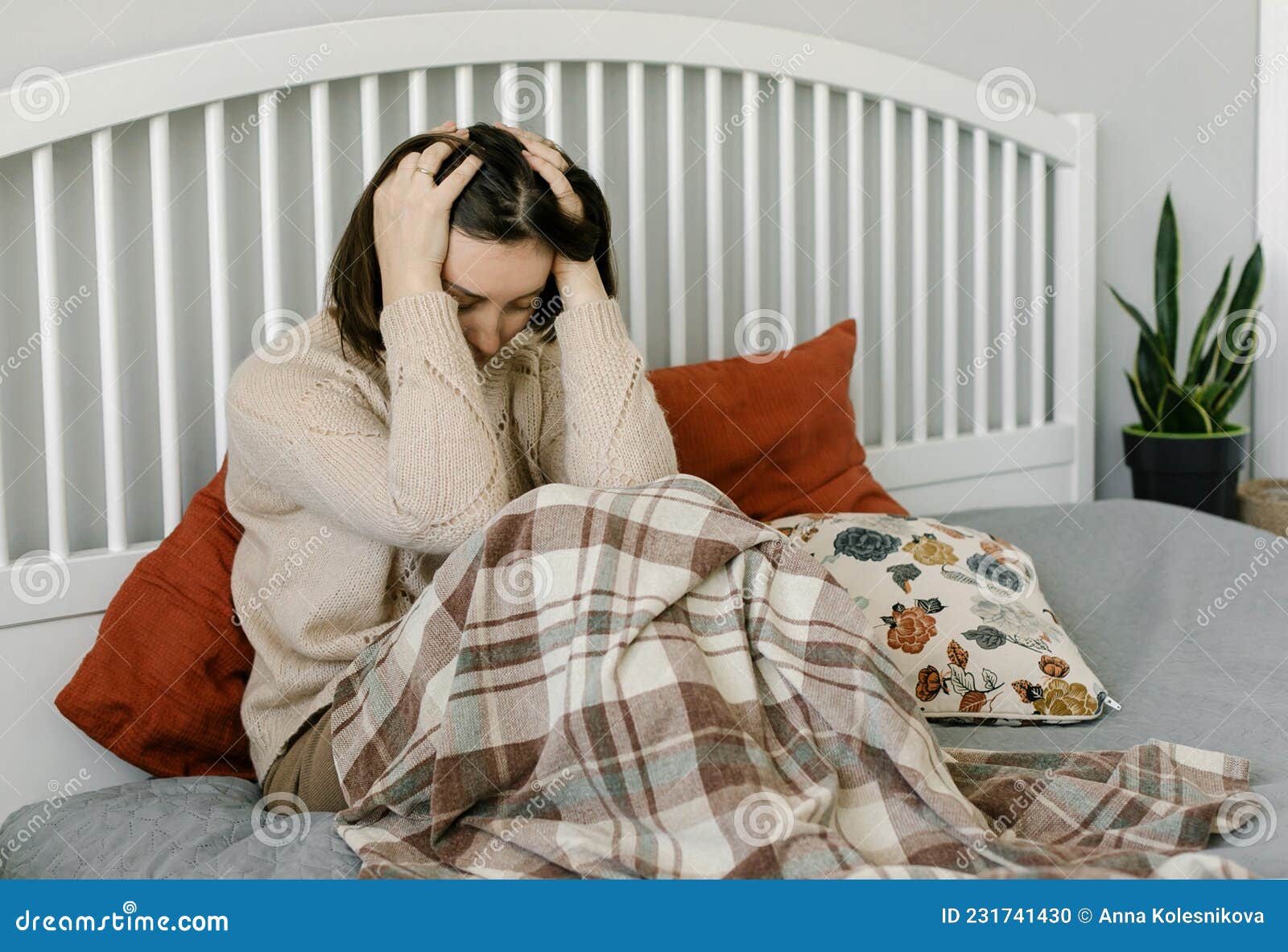 deppresed upset tired woman sitting on bed. the consequences of the disease coronavirus covid-19