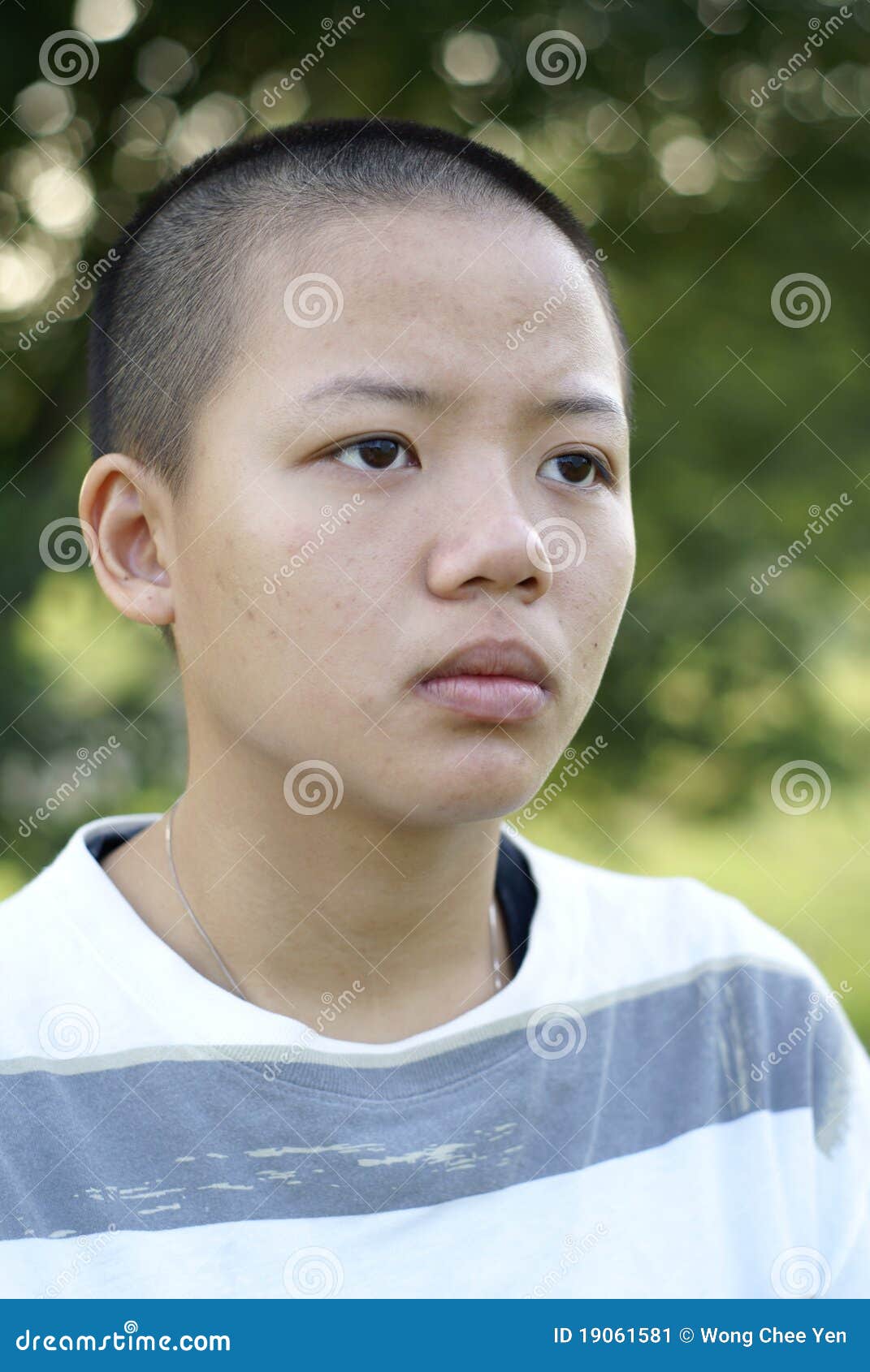 bald asian gets dressed in feathers