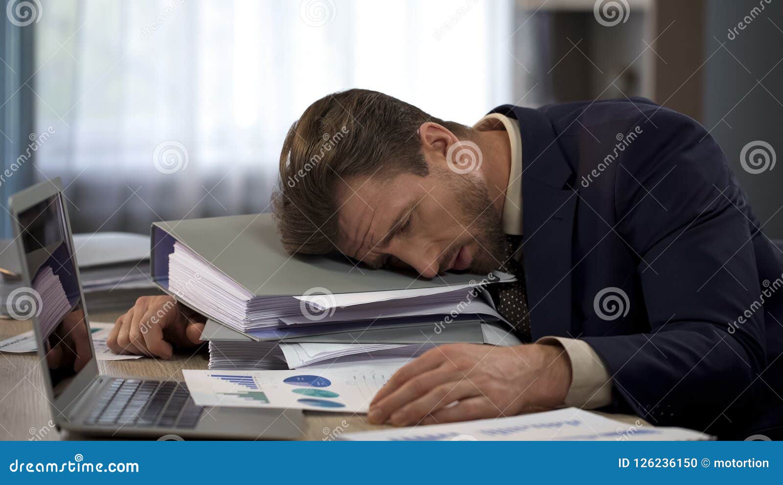 depressed businessman lying on pile of folders, deadline pressure, exhaustion