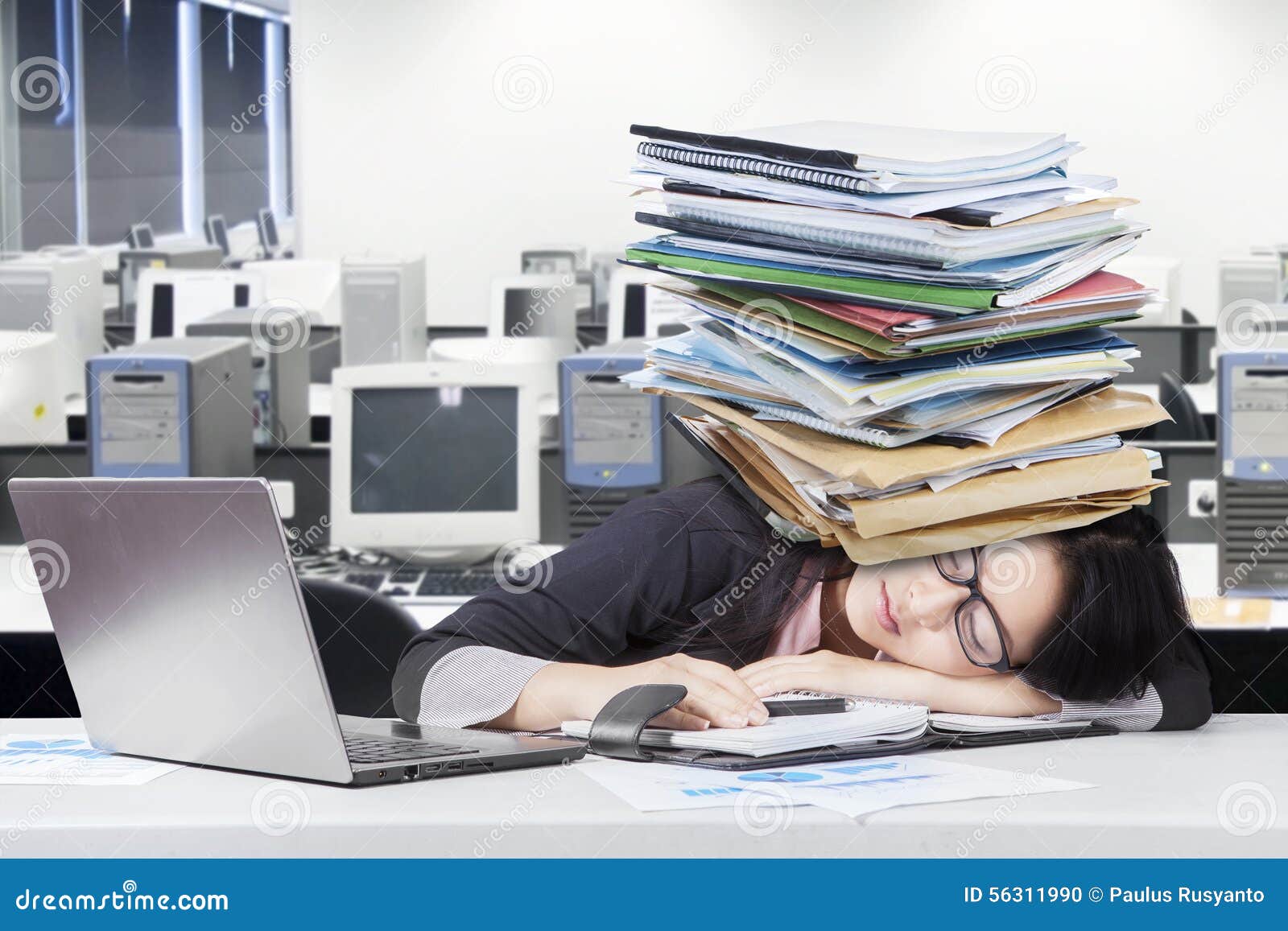 depressed female worker napping on desk