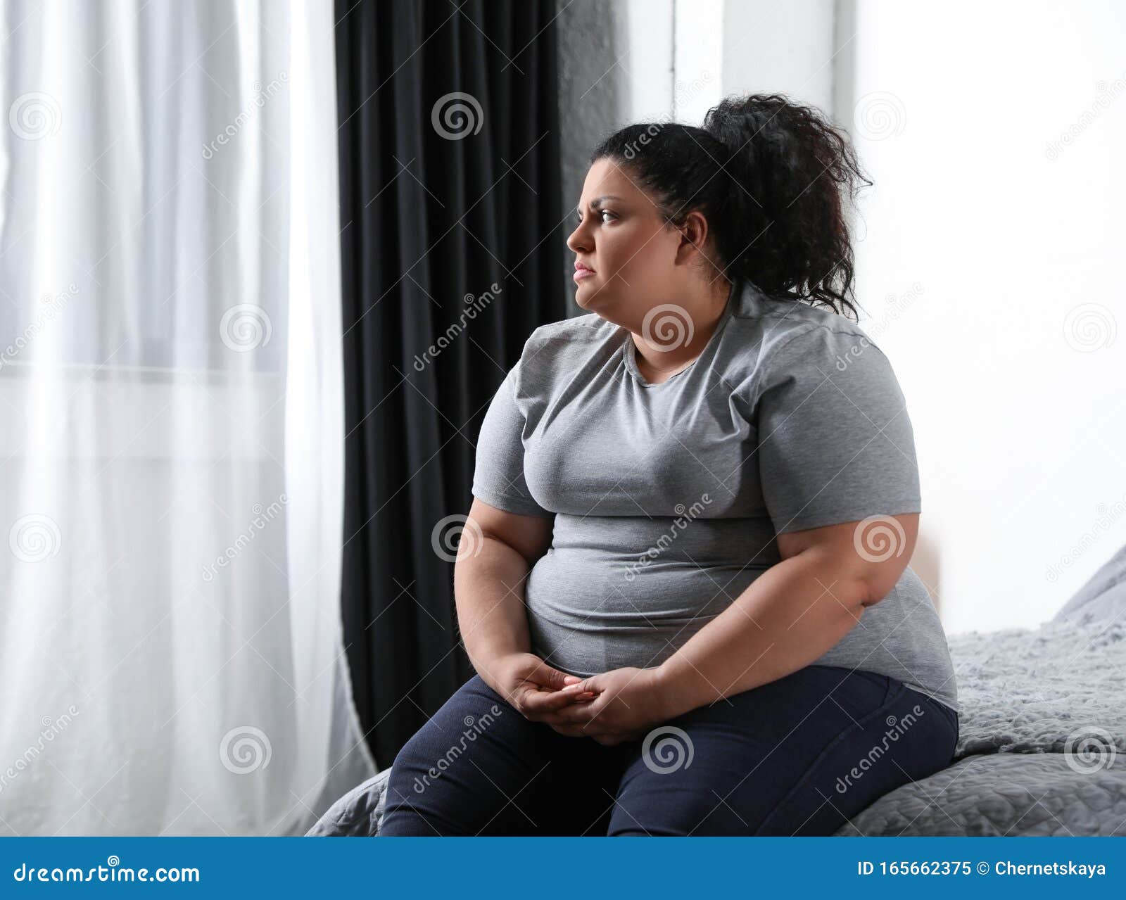 Depressed Overweight Woman Eating Sweets And Word STRESS Stock Image depressed-overweight-woman-eating-sweets-and-word-stress-stock-image