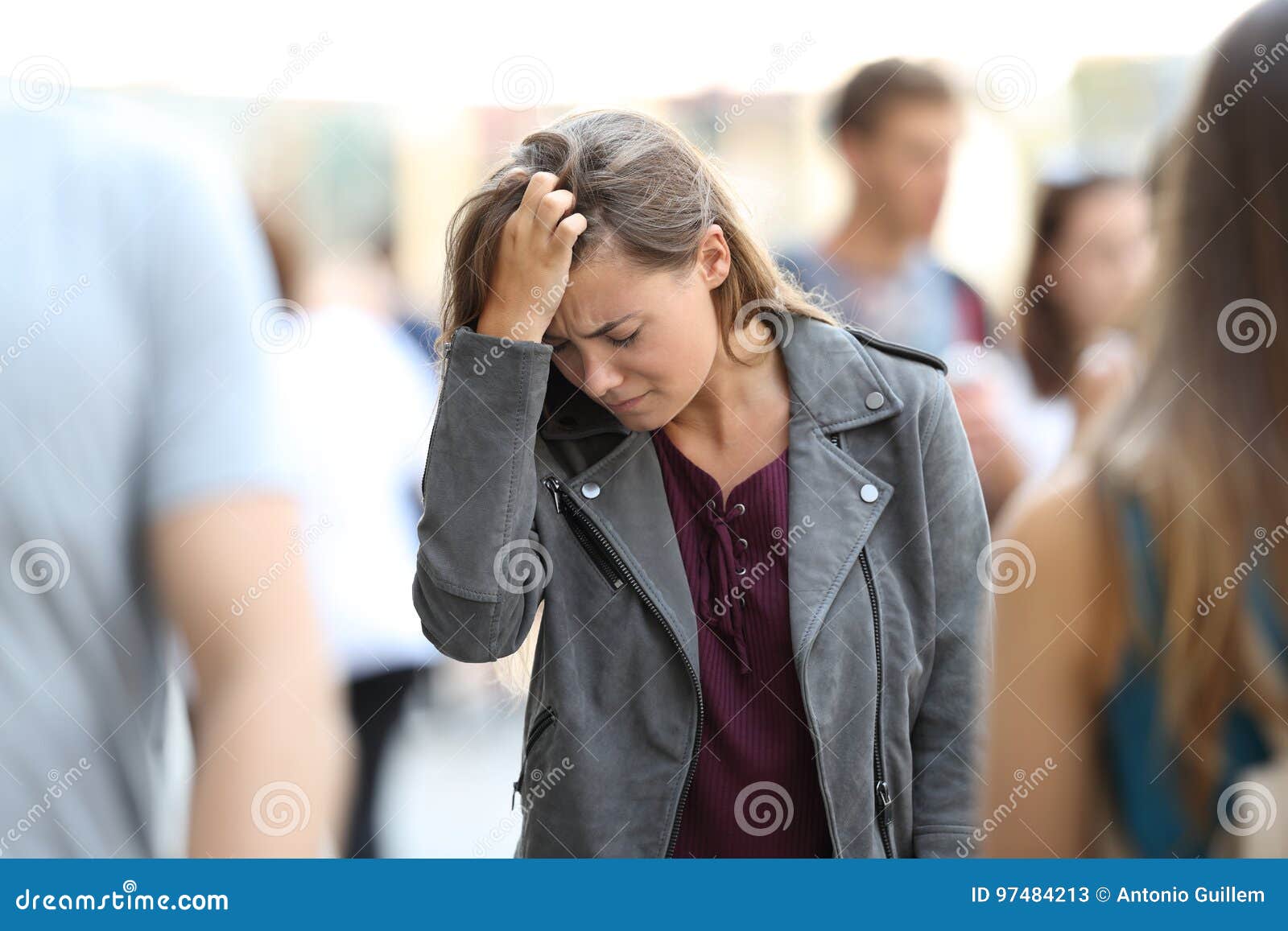 depressed teen feeling lonely surrounded by people