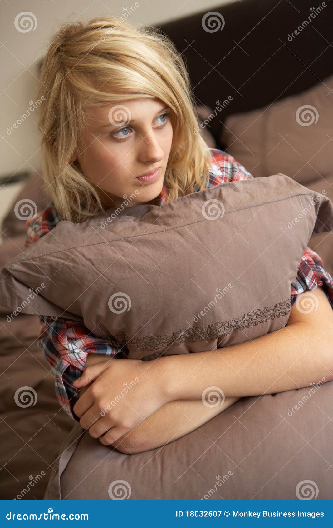 Depressed Teenage Girl Hugging Pillow in Bedroom Stock Image - Image of ...