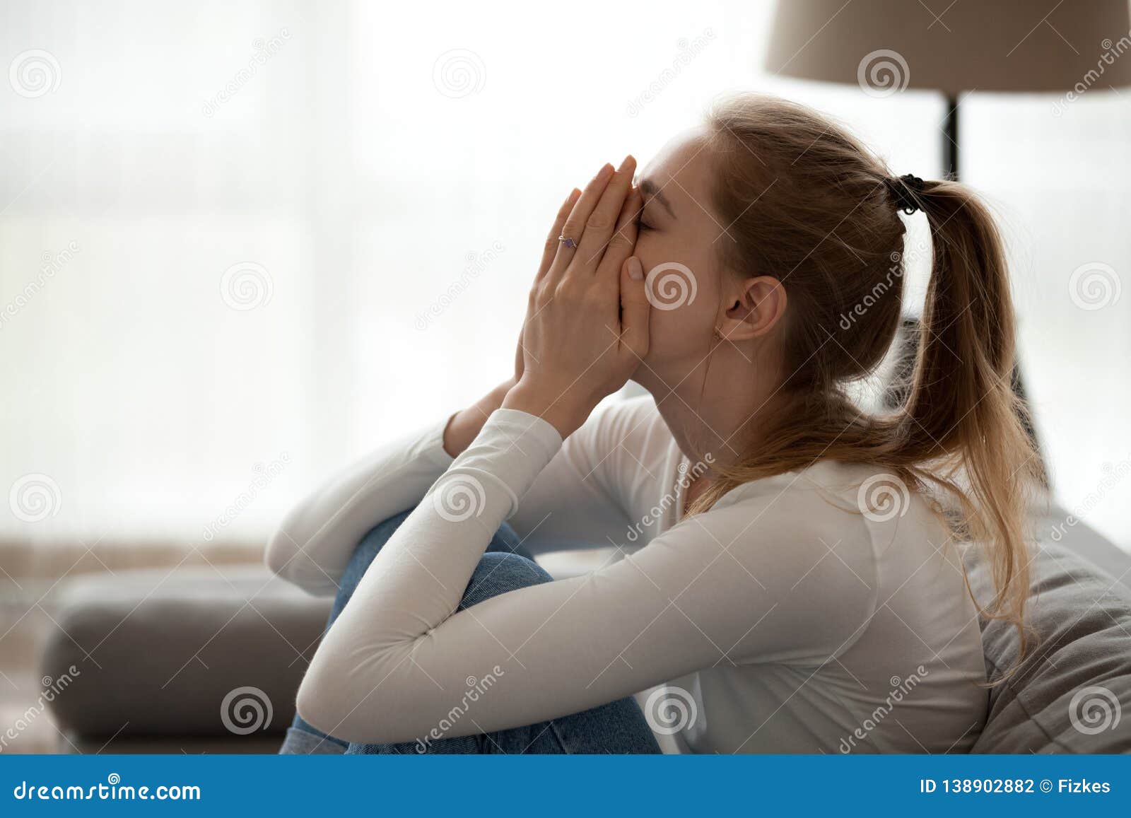 Depressed Upset Young Woman Crying Alone at Home Stock Photo ...
