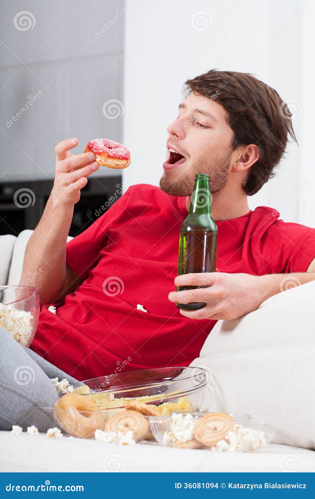 Depressed Young Man Eating Sweets Stock Photo Image of beer, leisure