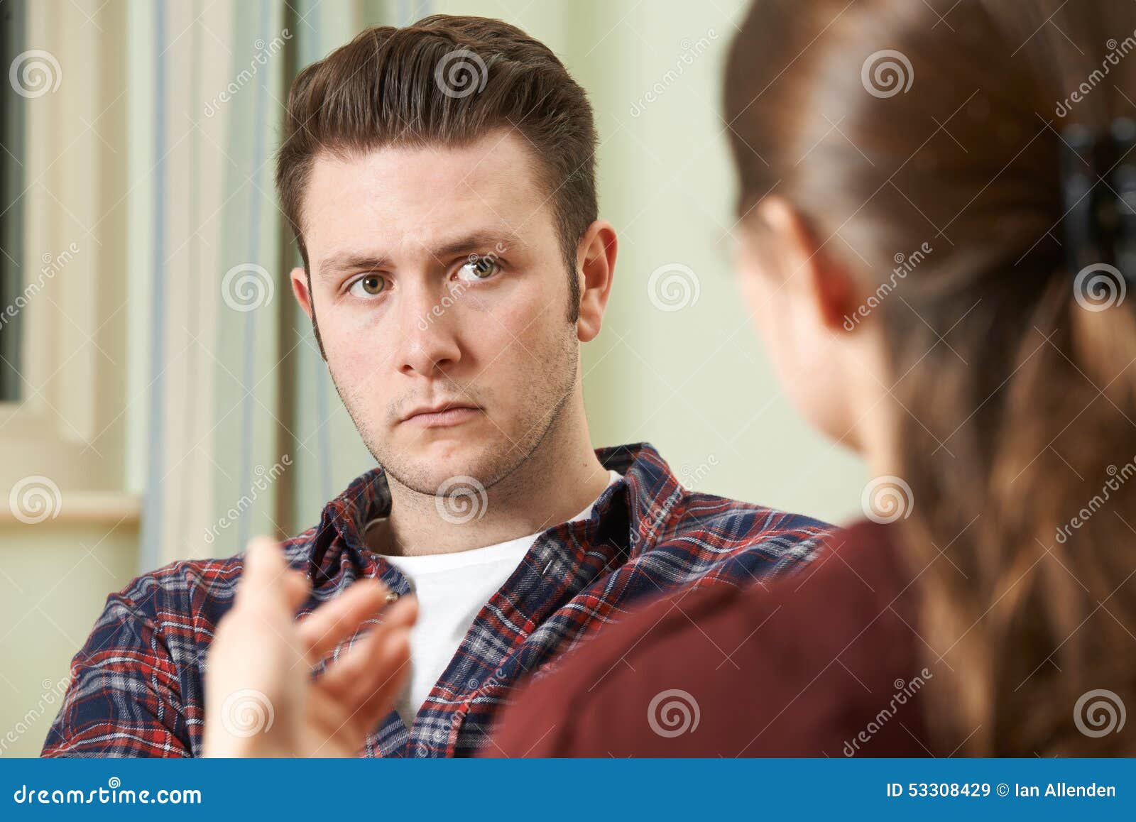 depressed young man talking to counsellor