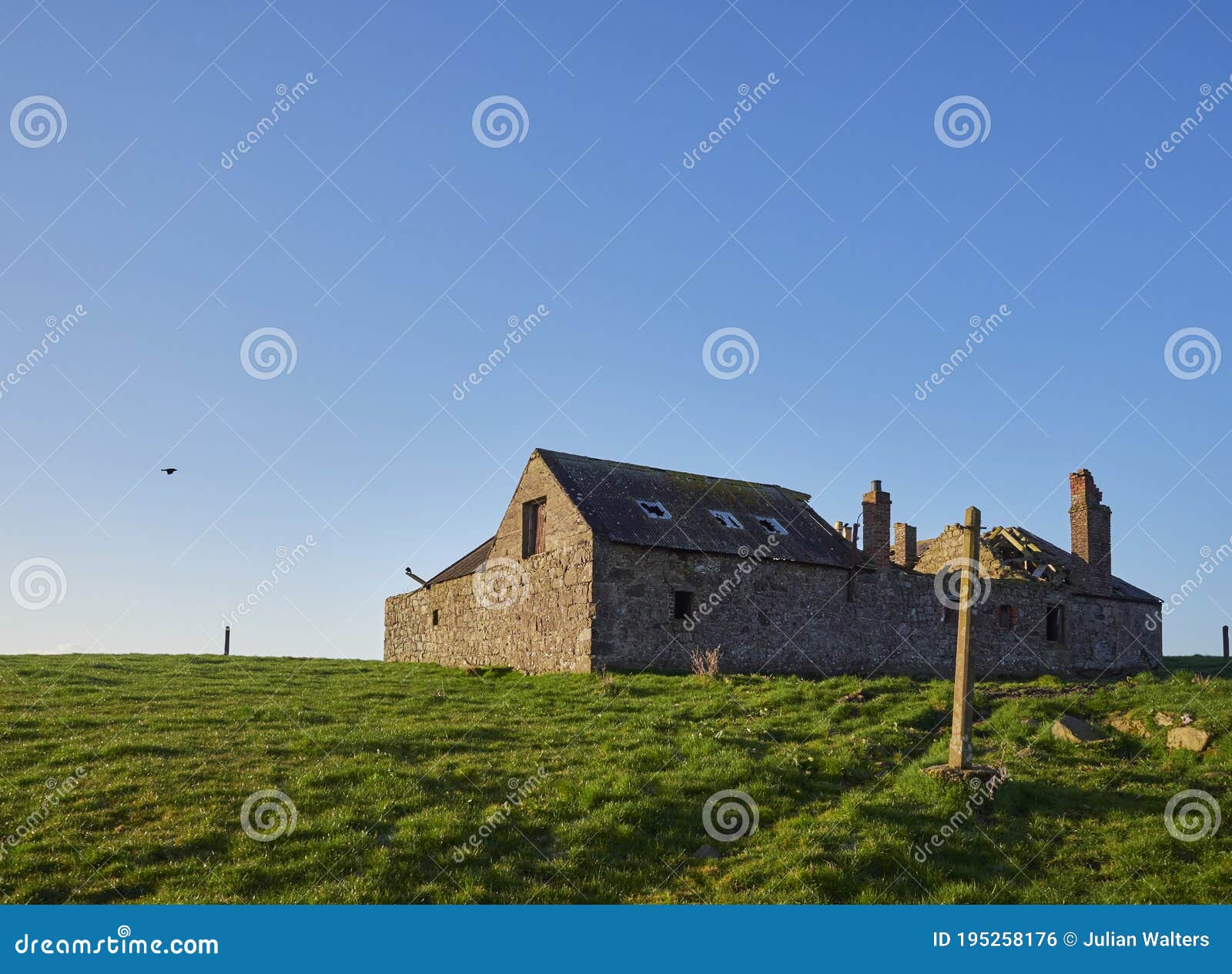 ruined and abandoned farm buildings near to the scottish coast at usan, with its roof collapsed in.