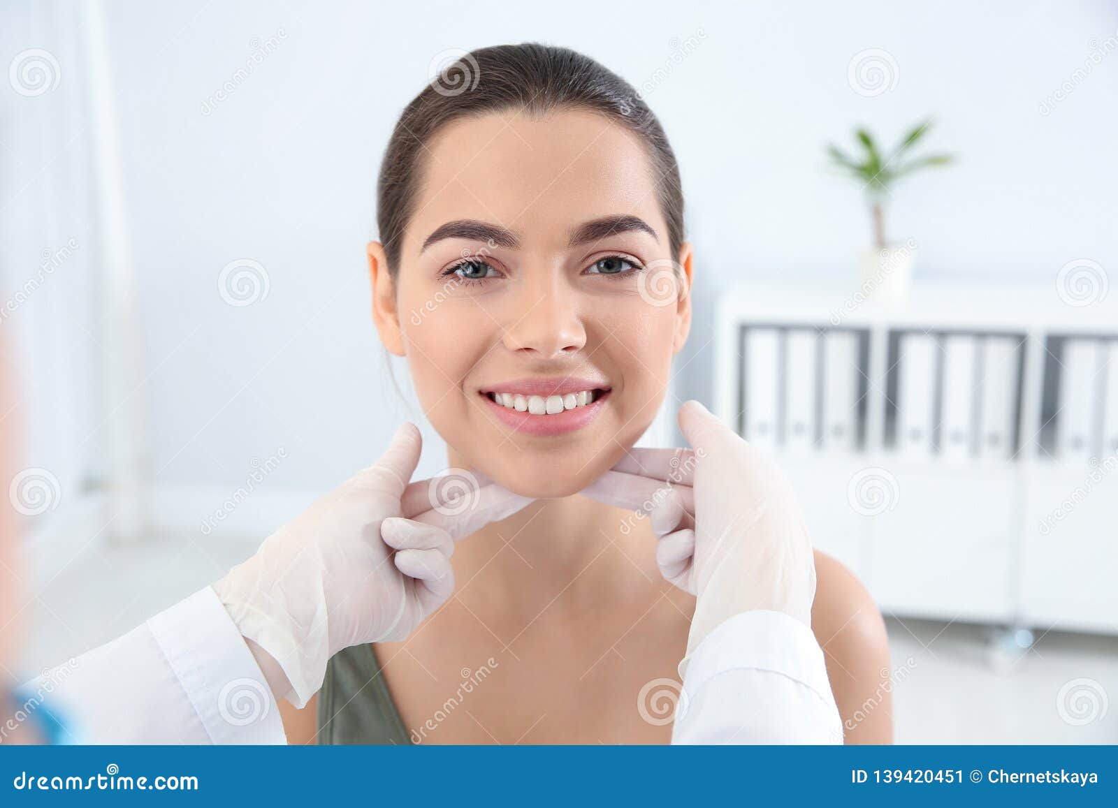 Dermatologist Examining Patient`s Face In Clinic Stock Image Image