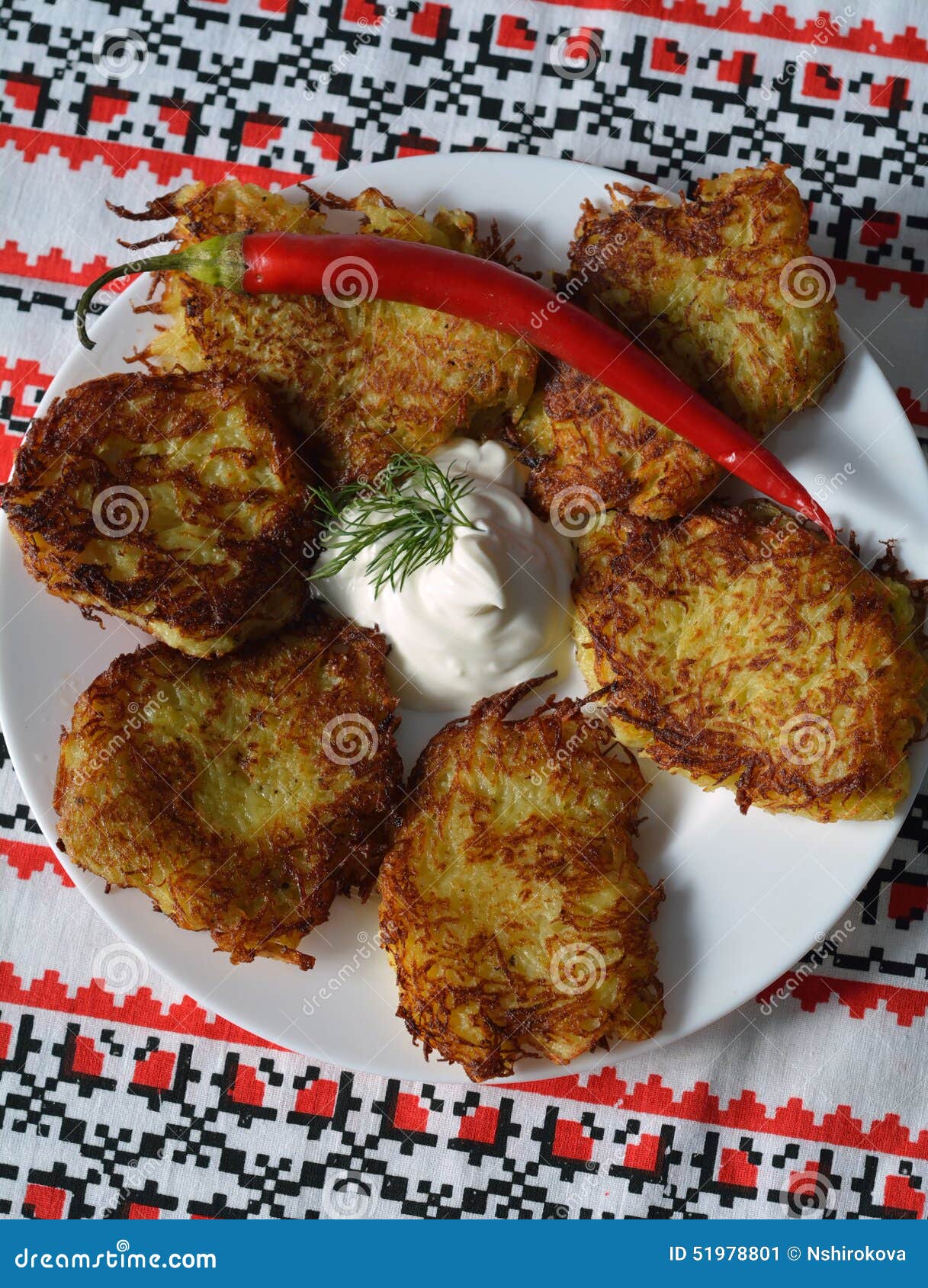 deruni (potato pancakes) on a traditional ukrainian towel