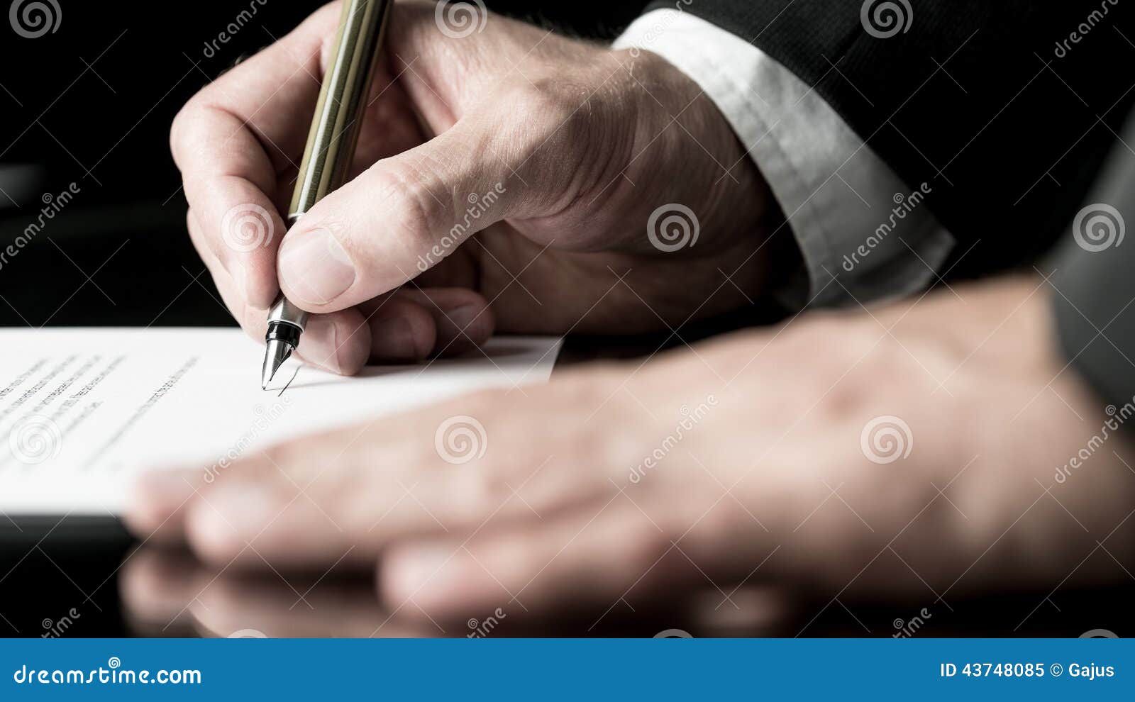 desaturated image of signing a contract