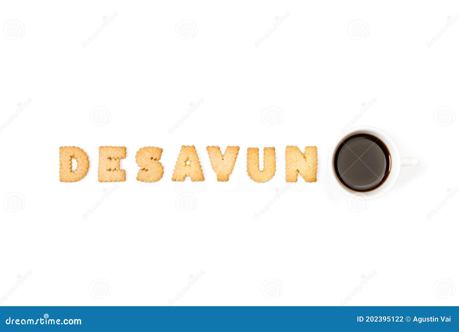 desayuno with alphabet letters cookies and a cup of coffee on a white background
