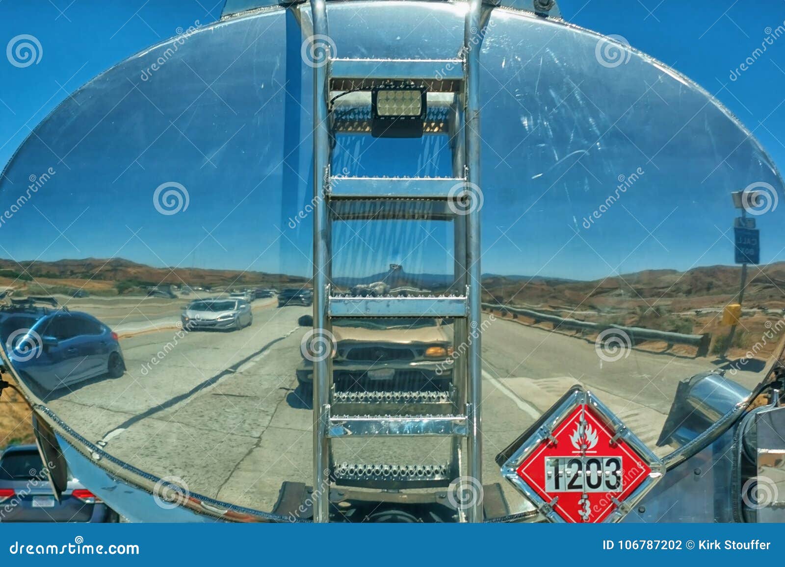 desert-landscape-busy-roadway-reflected-shiny-stainless-steel-aluminum-tank-gas-truck-traveling-down-106787202.jpg