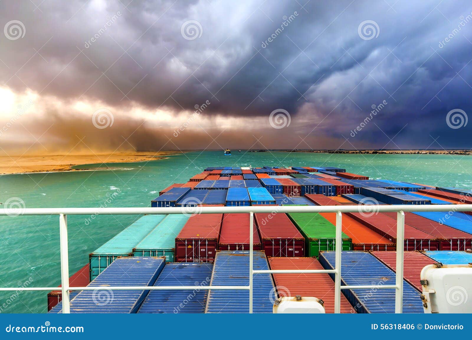desert storm in suez canal, egypt. large container ship in convoy.