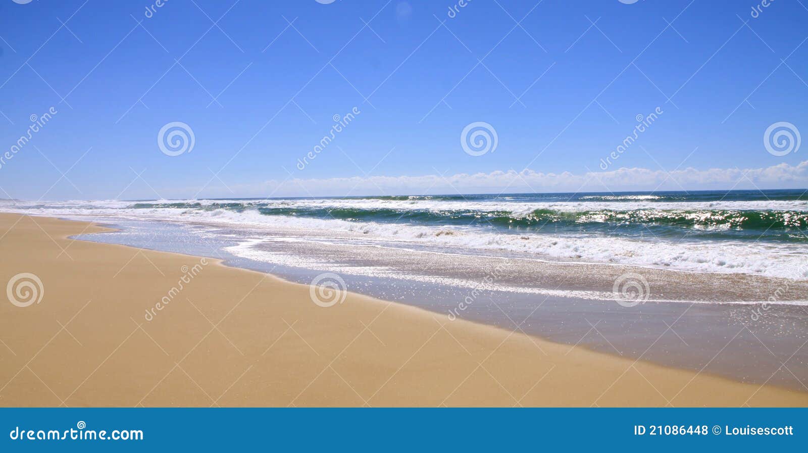 Beautiful deserted beach, bright blue sky and yellow sand