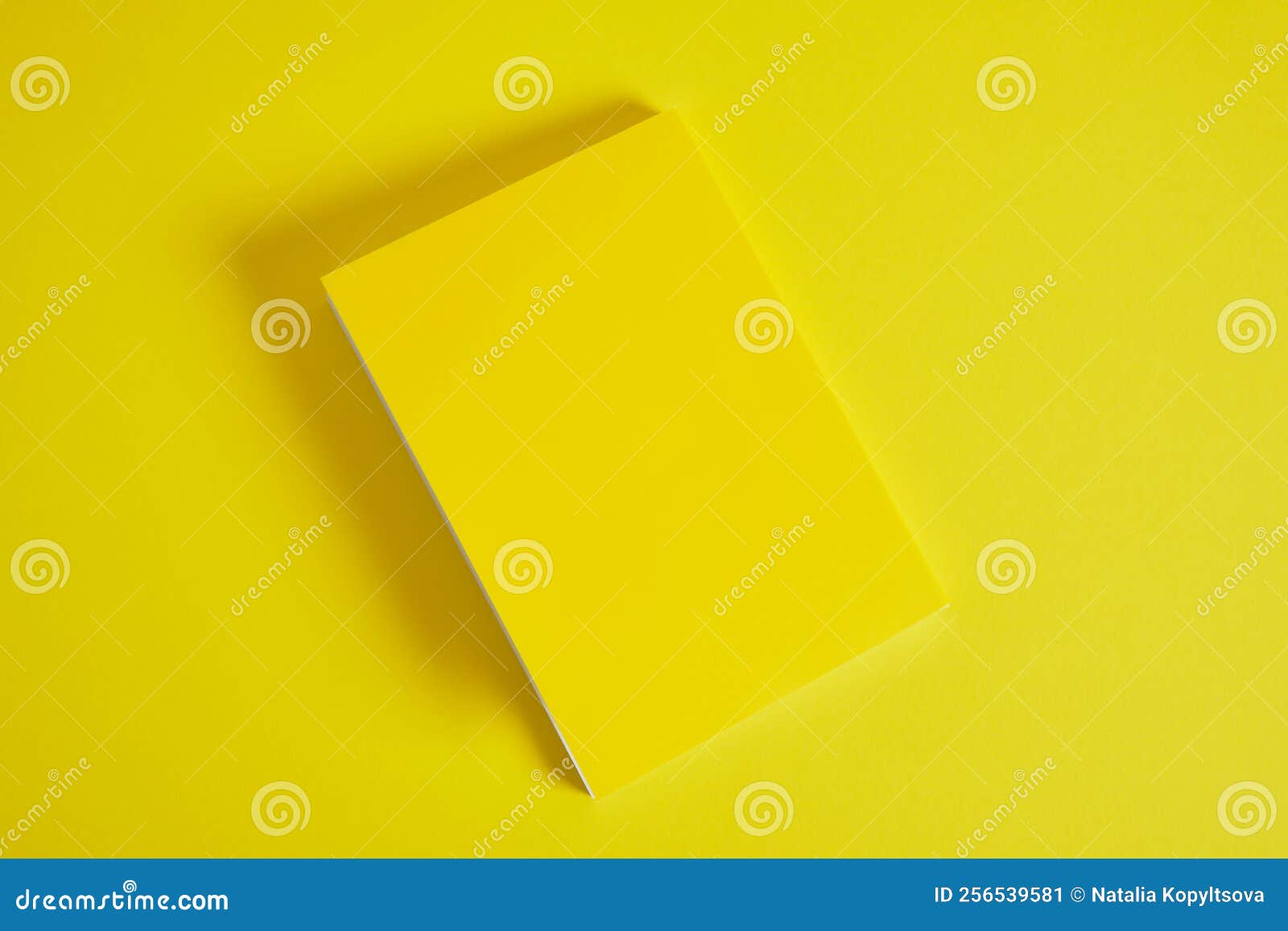  concept - top view of yellow notebook and pen collection  on ryellow ed background for mockup
