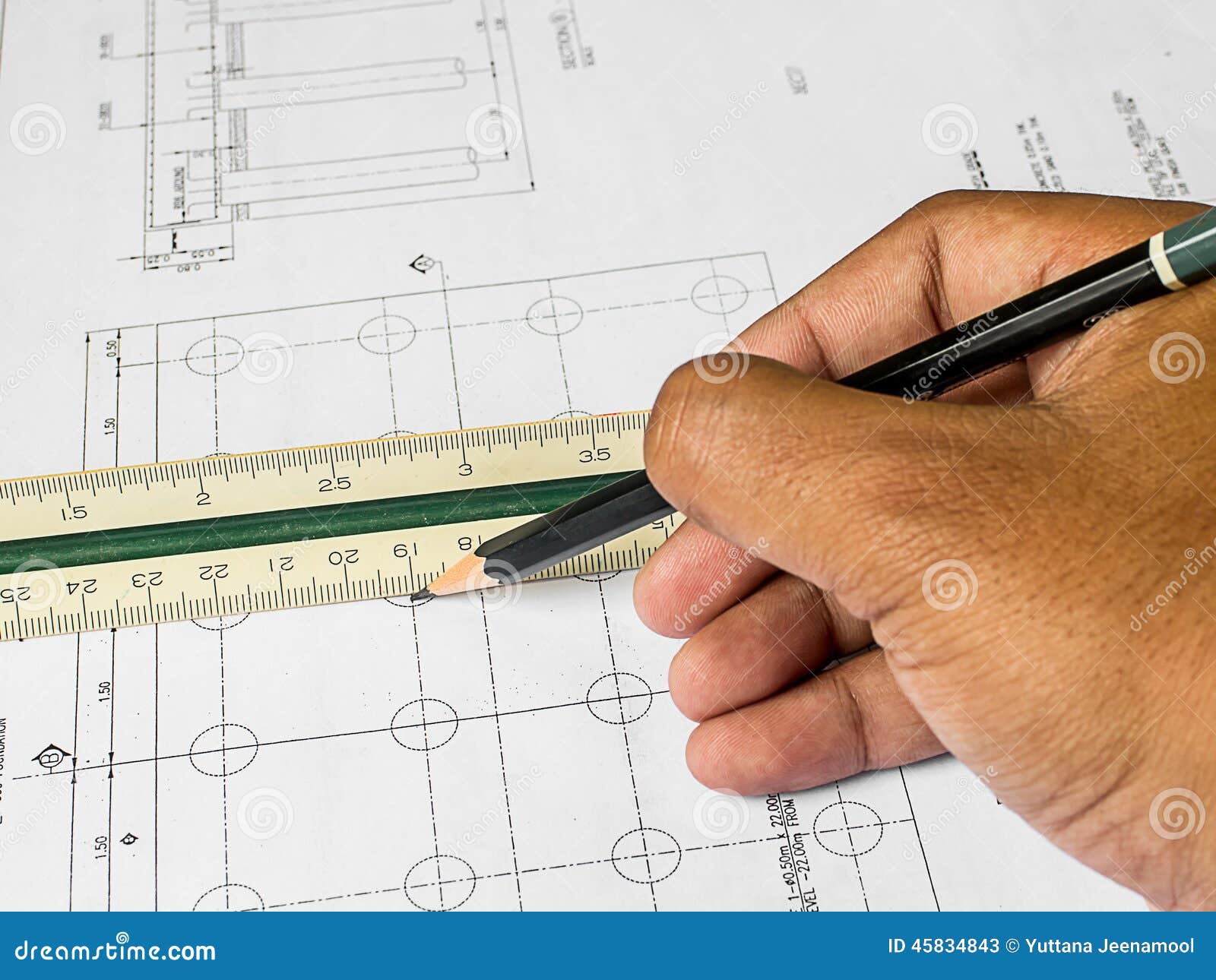 Design Drawings and Human Hands Drawing a Project by Pencil on P Stock