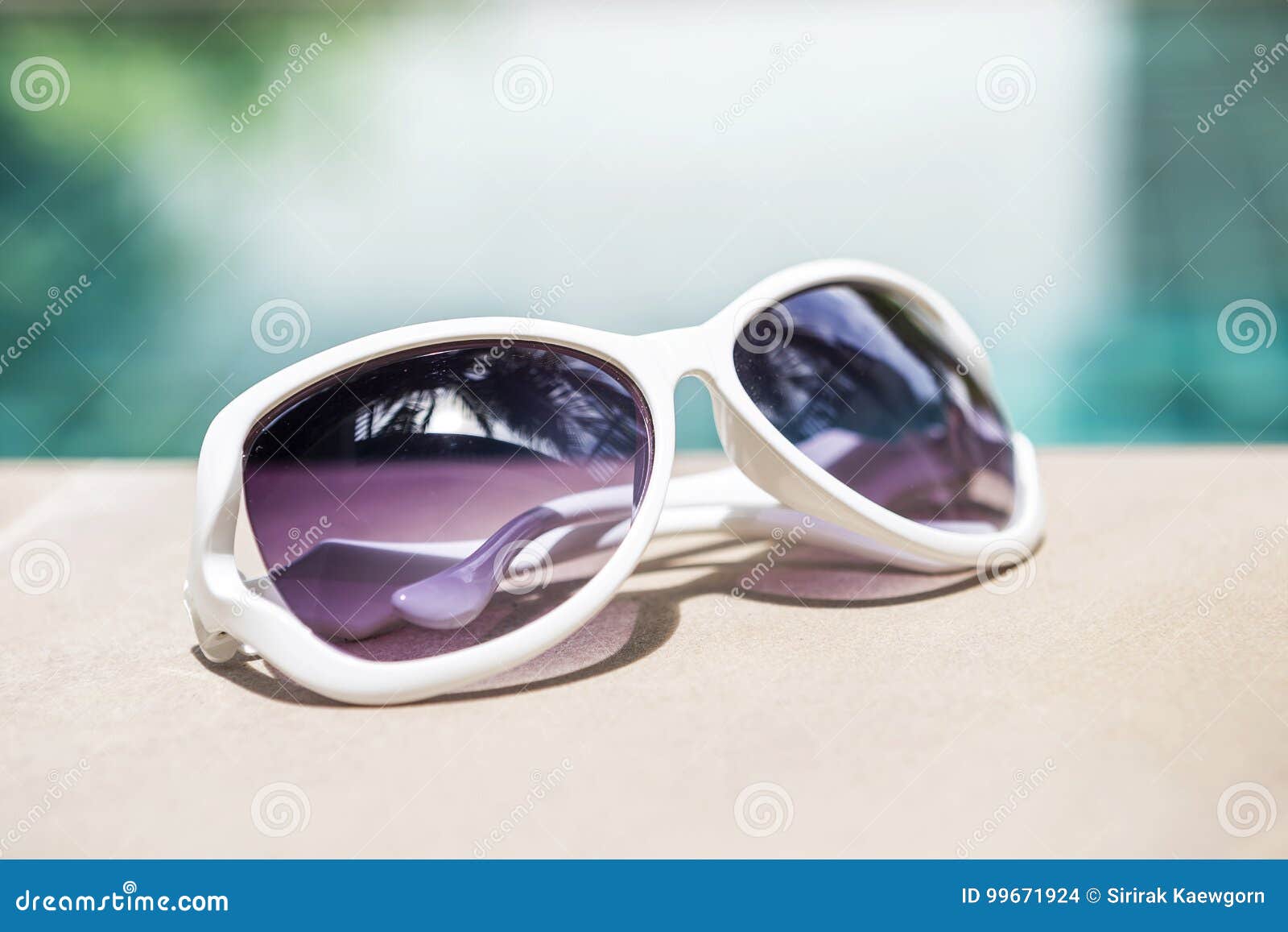 Design White Sunglasses on Swimming Pool Edge Stock Photo - Image of ...