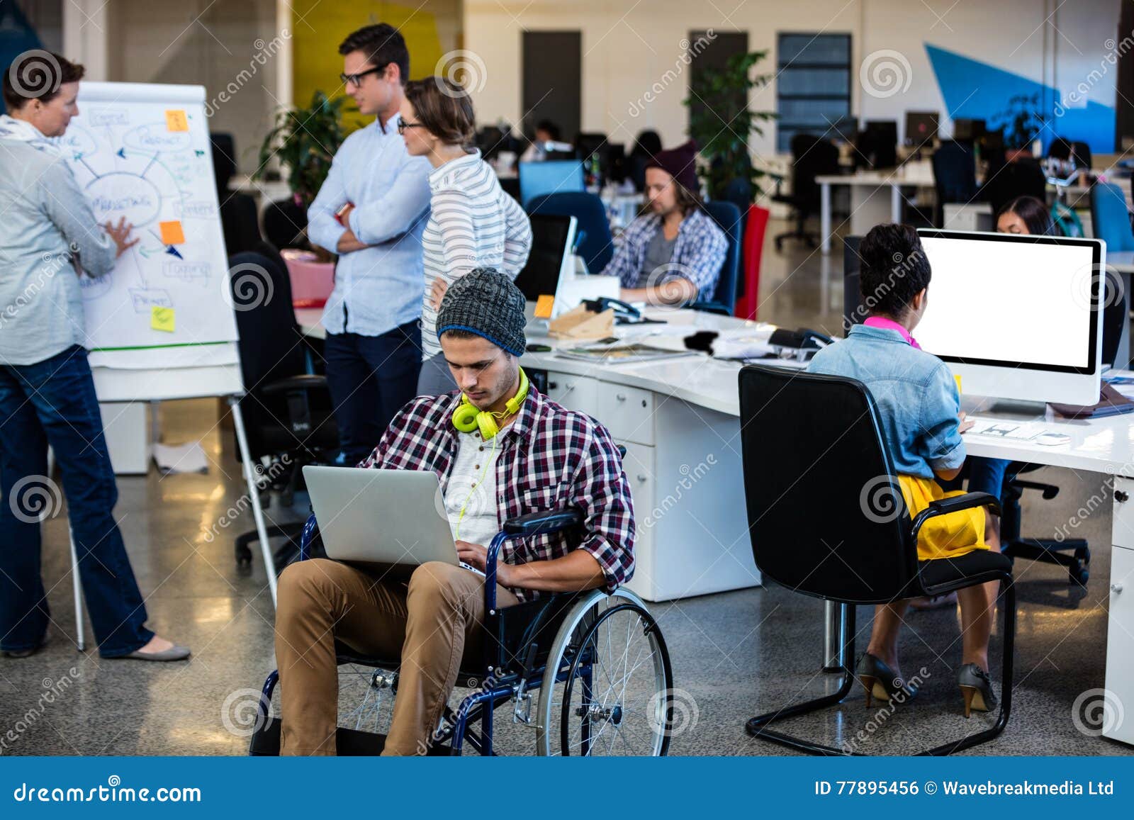 Designer in a Wheelchair with a Computer Stock Photo Image of mature