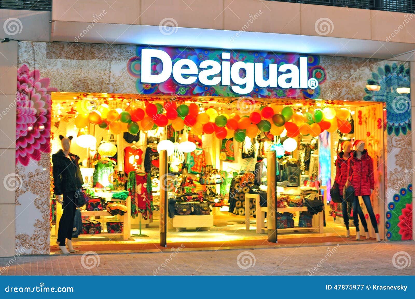 Women look through the clothing collection during Desigual's Semi
