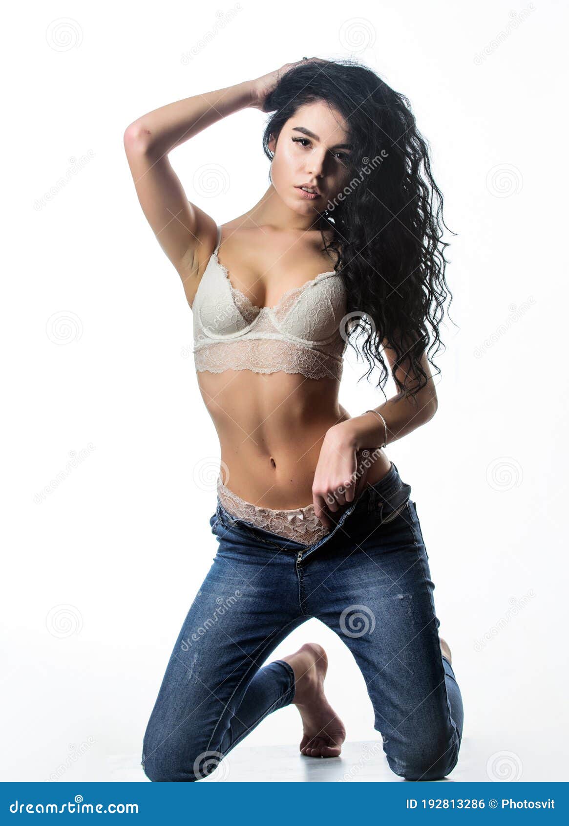 desirable fashion model. fit and sexy. curly seductress. hot lady undressing. woman long curly hairstyle wear lace