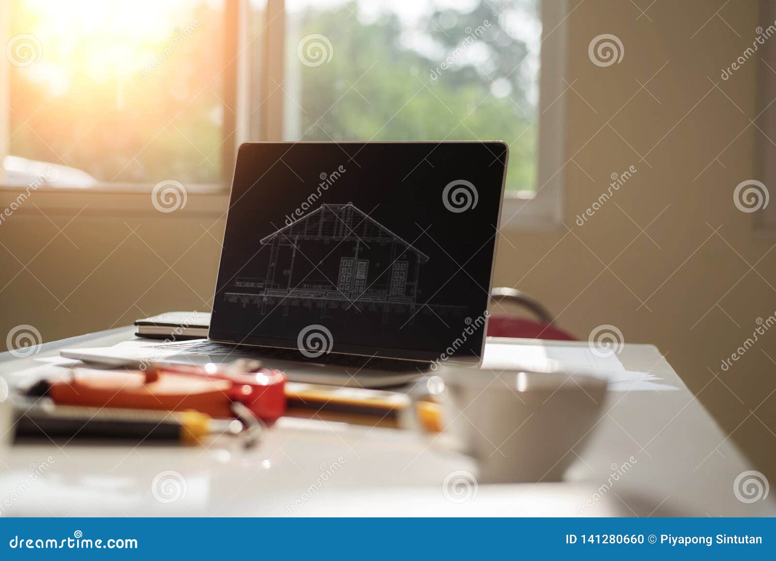 Desk Of Architects Engineer With A Blueprint On Table In The