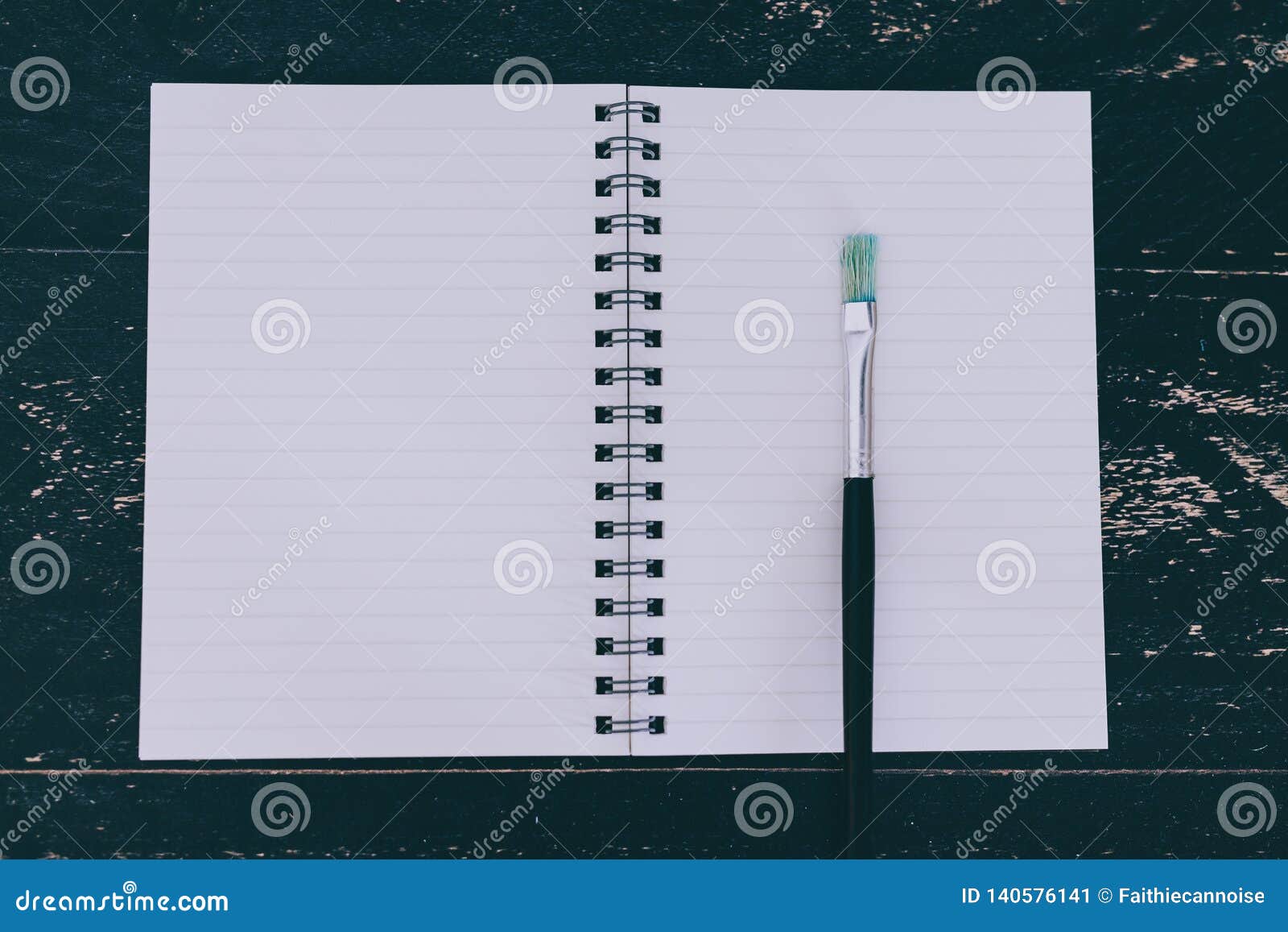 Desk With Notepads And Watercolour Brushes With Empty Pages And