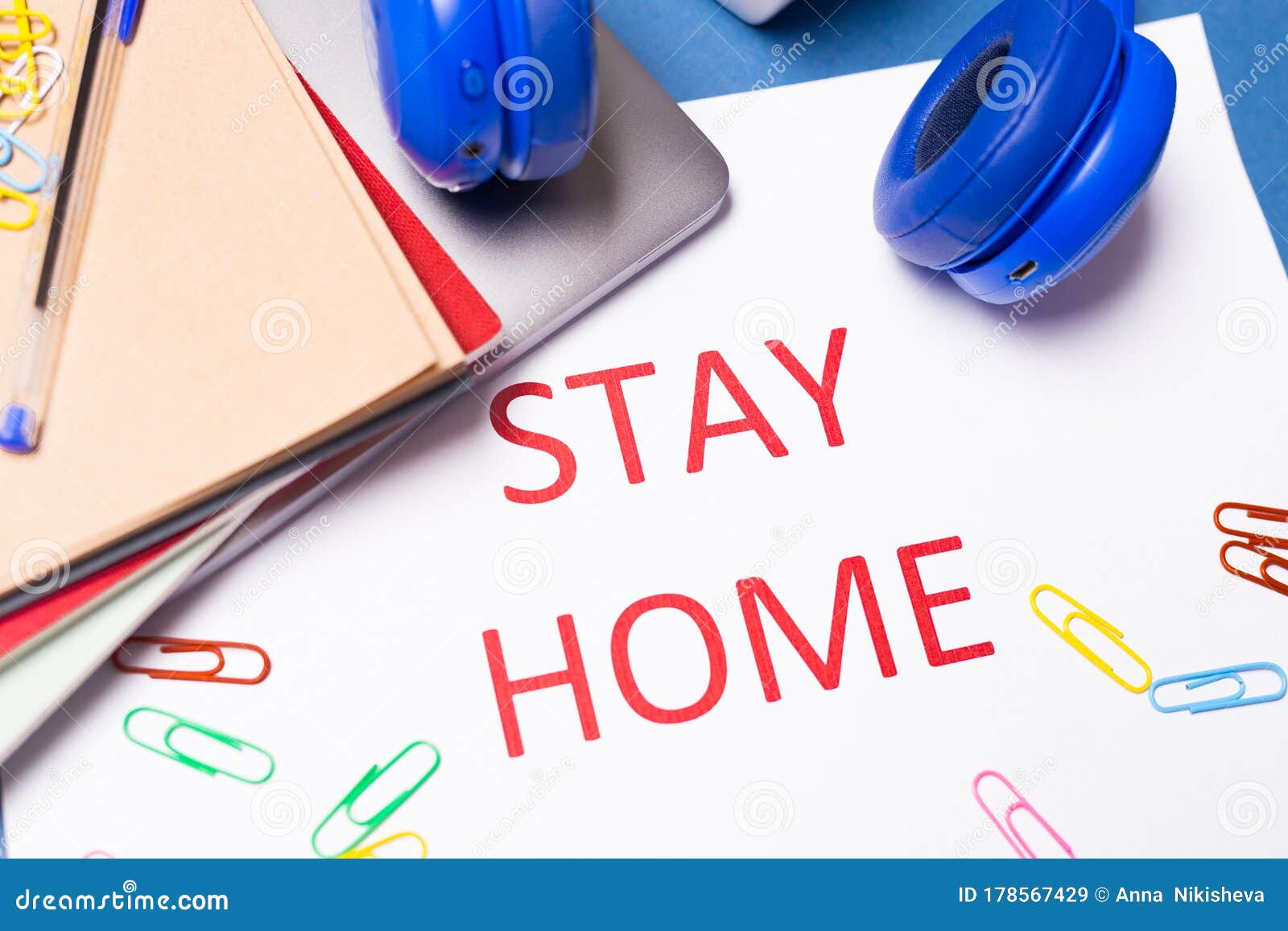 desk top with words stay at home. coronavirus pandemic protection concept. stay safe, concept of self quarantine at home