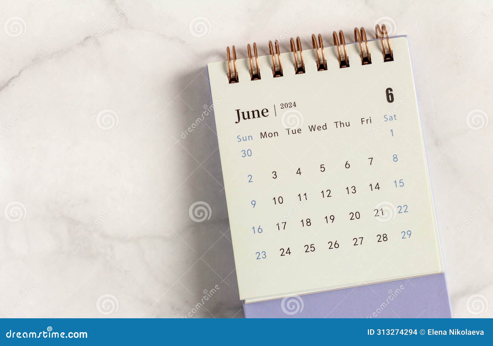 Desktop calendar for June 2024 on a light background.