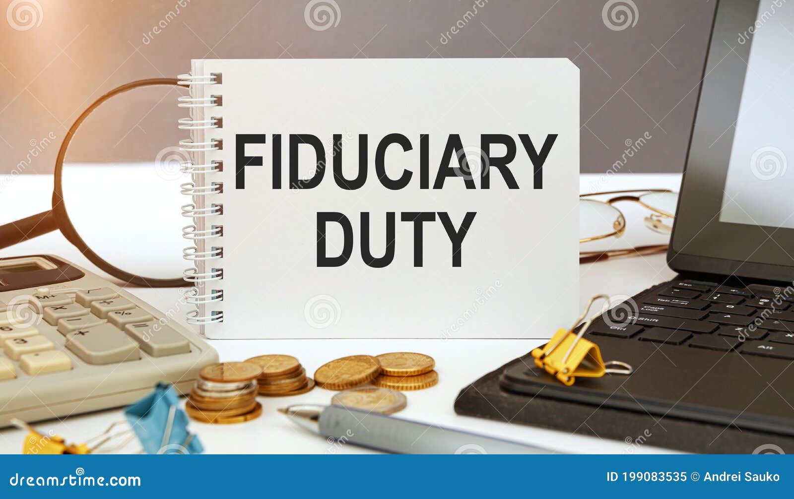 desktop with documents, calculator and notebook. inscription fiduciary duty